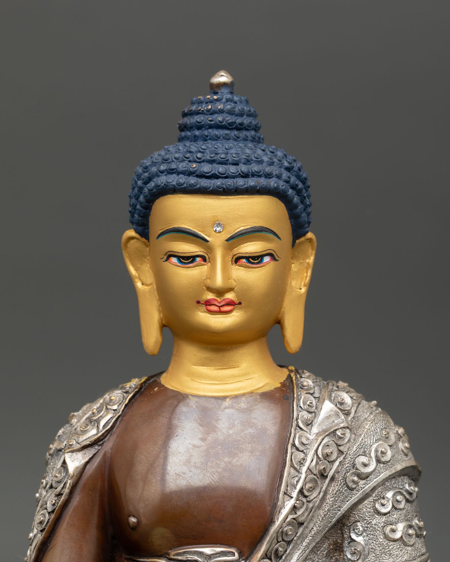 Close-up of Buddha face, gold-gilded, serene expression, artisan-crafted sacred art, Nepal