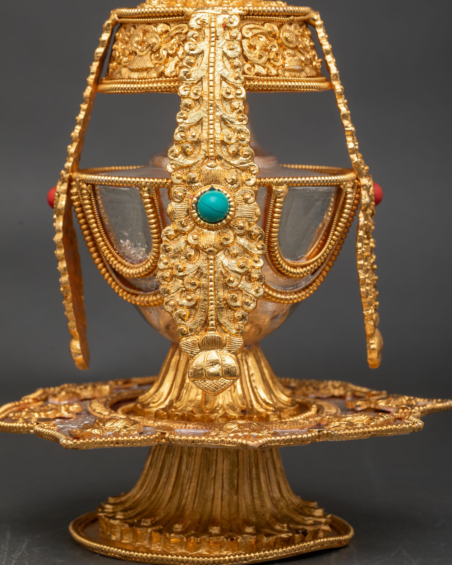 Close up Che Bumba ritual vessel with stone inlay and metal details