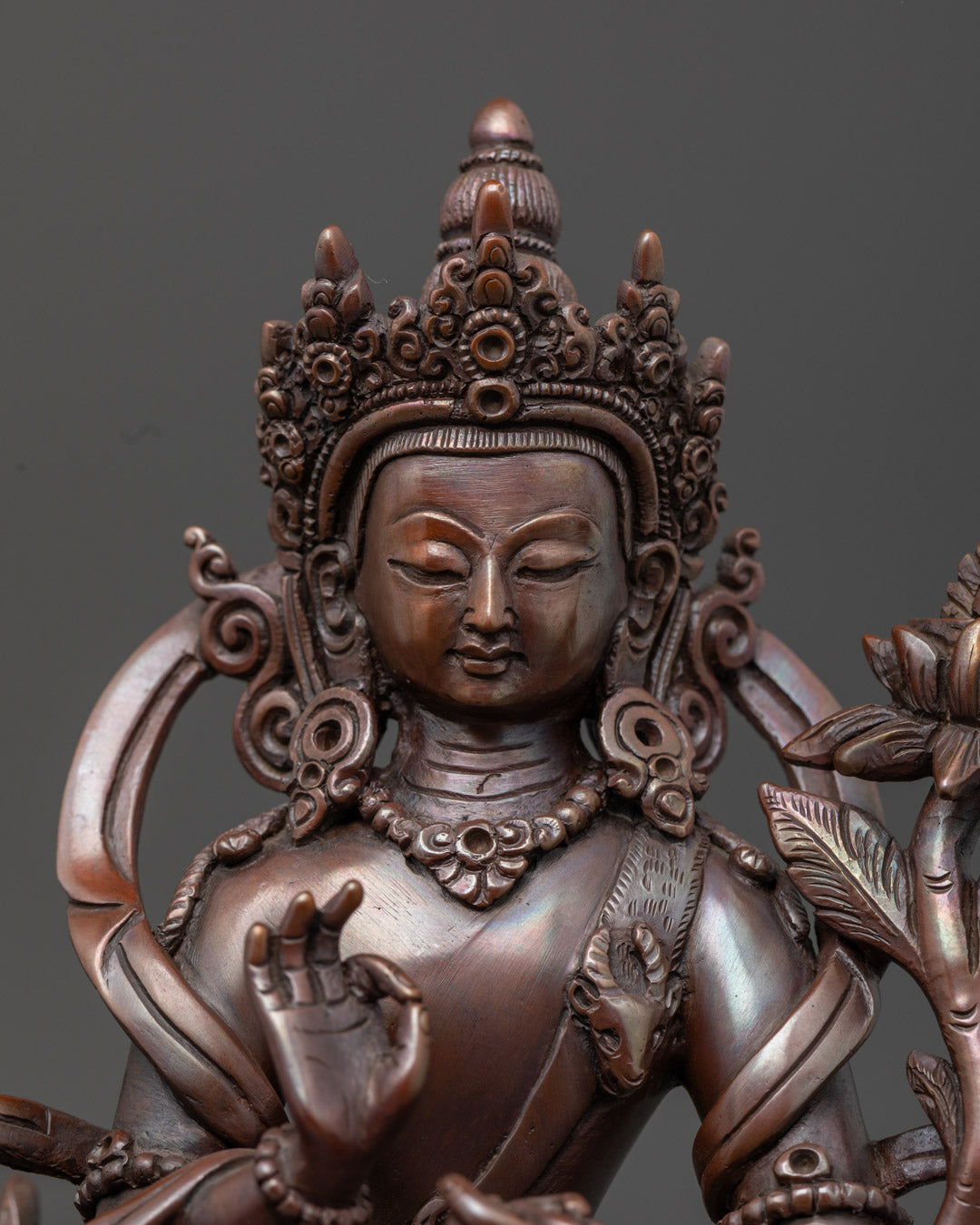 Close up Chenrezig face detail ornate crown lotus prabhavali Himalayan Newari craftsmanship Nepal
