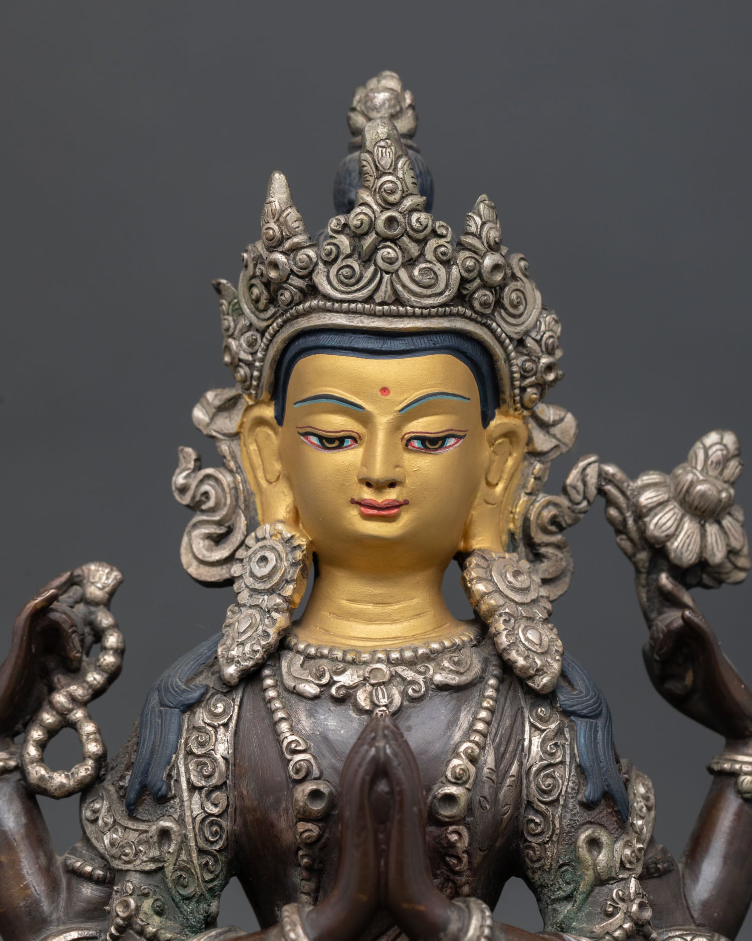 close up chenrezig statue oxidized copper silver finish bodhisattva detail newari craft nepal