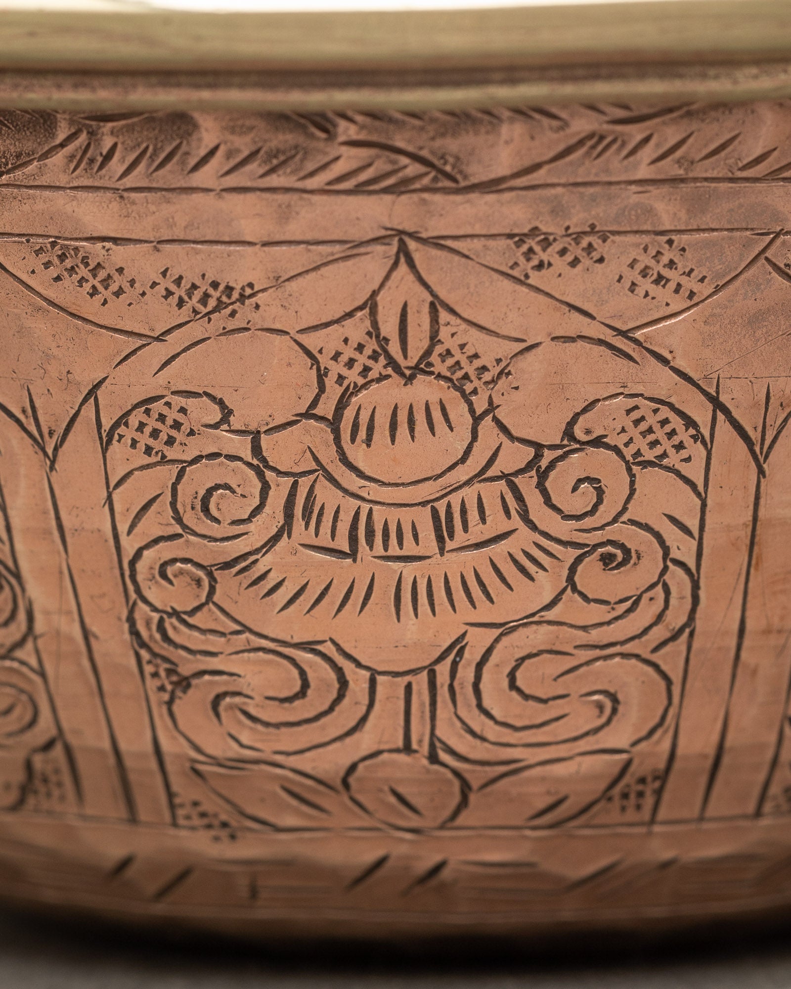 Close up engraved water offering bowl copper featuring auspicious Buddhist symbols