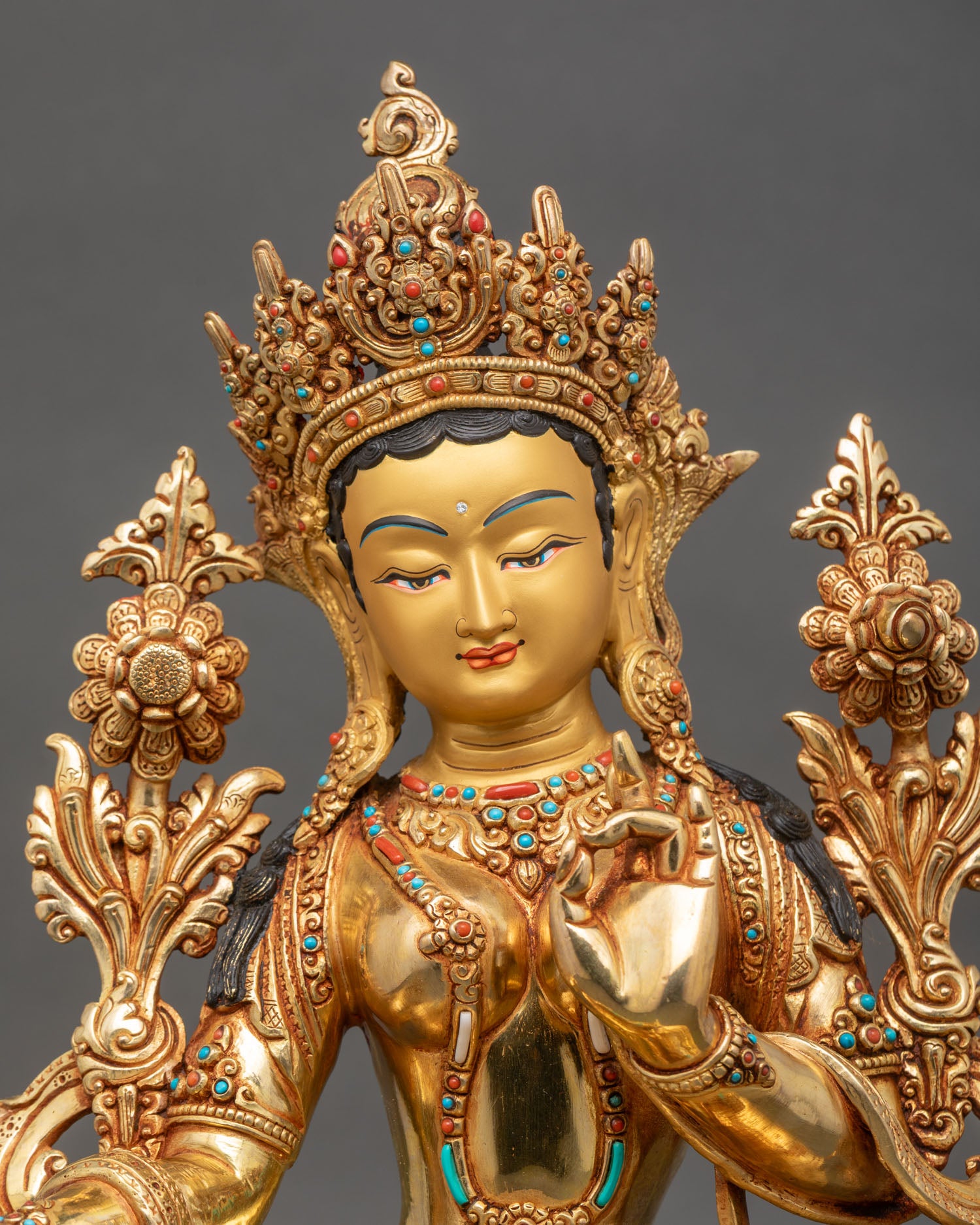 Close up Green Tara gold painted face, turquoise, coral stones, utpala flower