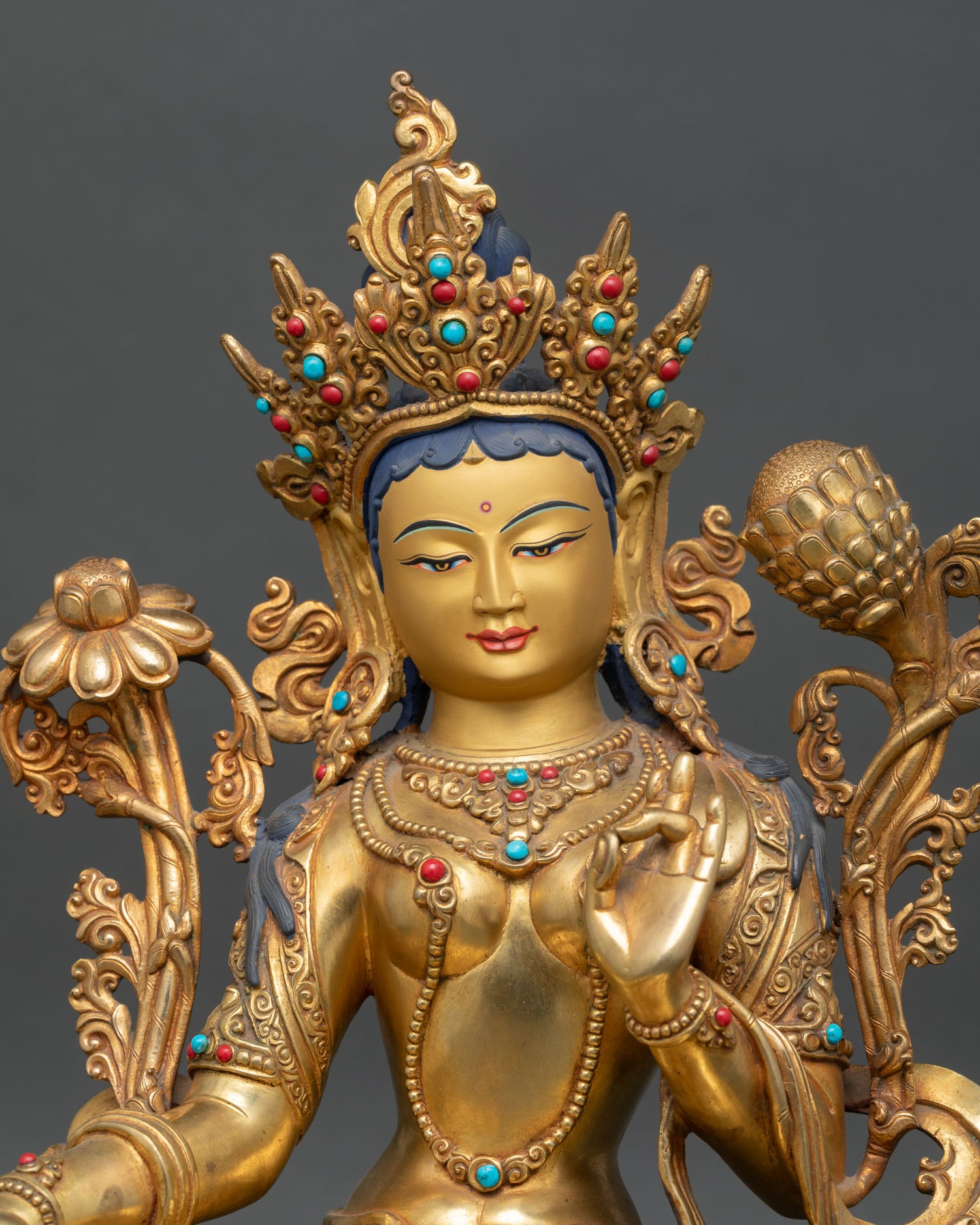 close up green tara statue showing fine copper detailing and hand crafted ornaments