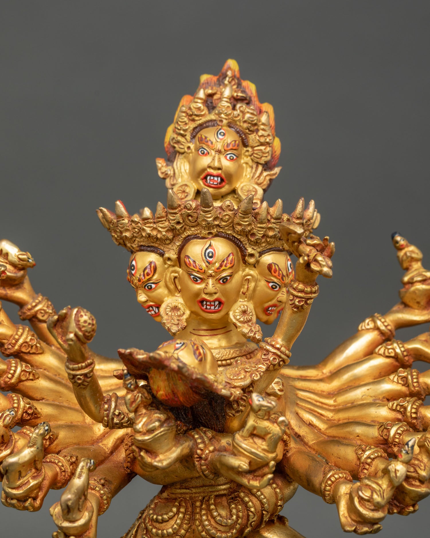Close up Hevajra statue detailed face gold painted finish radiant gold gilding premium copper Nepal Newari artisan craftsmanship