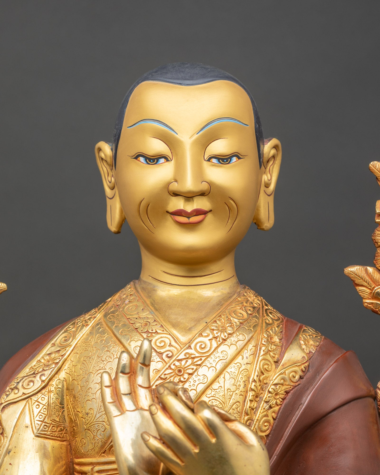Close up Je Tsongkhapa face detail radiant 24K gold painted expression Himalayan Buddhist art Newari craftsmanship sacred Gelug lineage statue