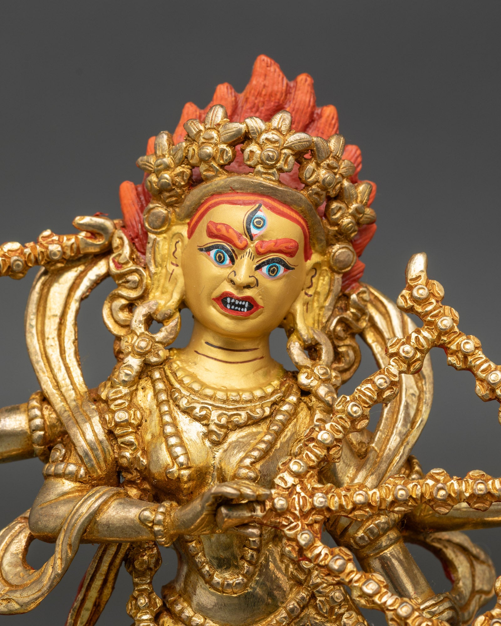 Close up Kurukulla face 24K gold painted Himalayan Buddhist sculpture handmade Nepal