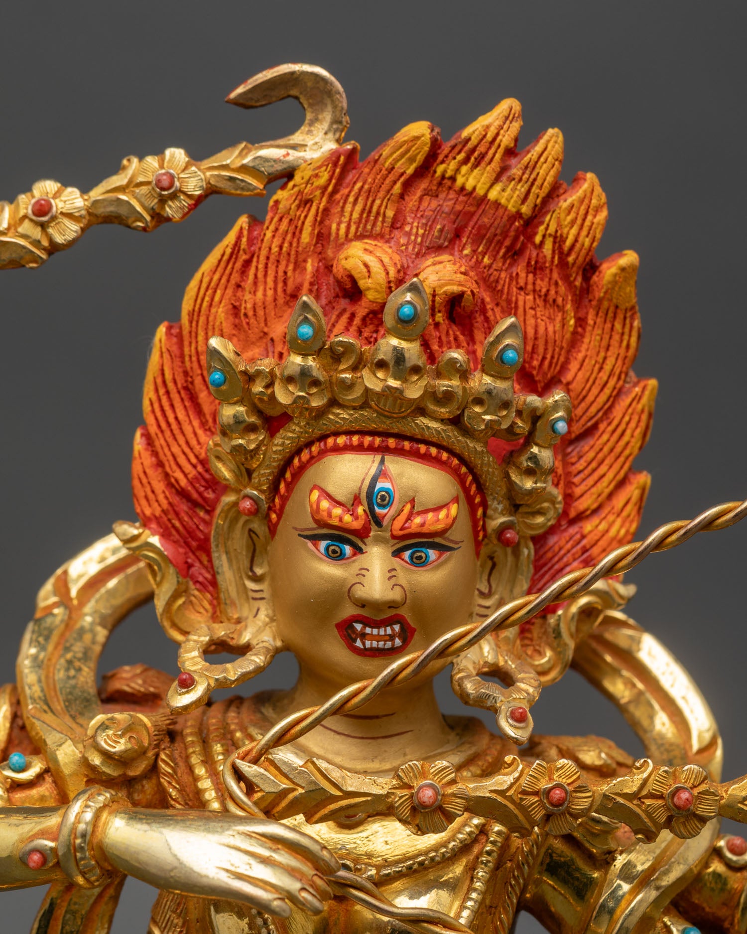 Close up Kurukulla face four arms hook noose flower arrows gold painted