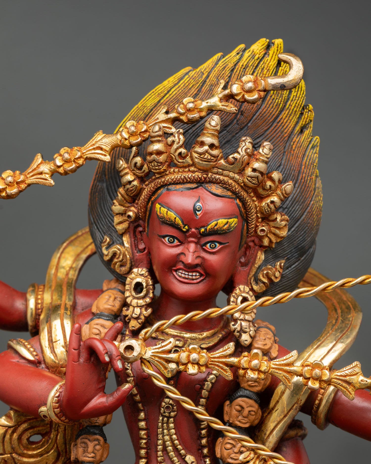 Close up Kurukulla face skull crown hand painted acrylic details tantric goddess statue Patan Nepal sacred Buddhist art