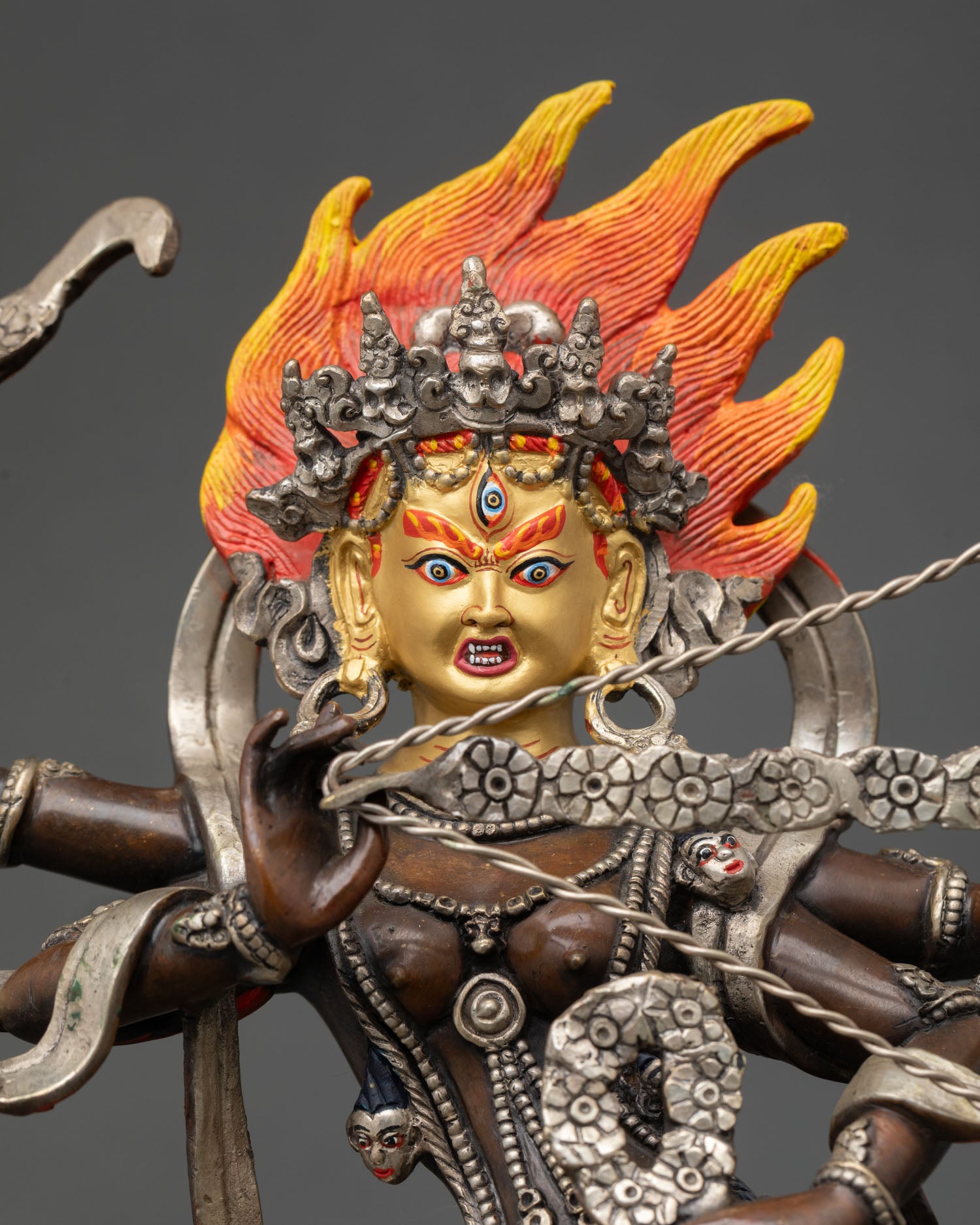 Close-up Kurukulla statue, intricate oxidized copper Himalayan Buddhist craftsmanship details