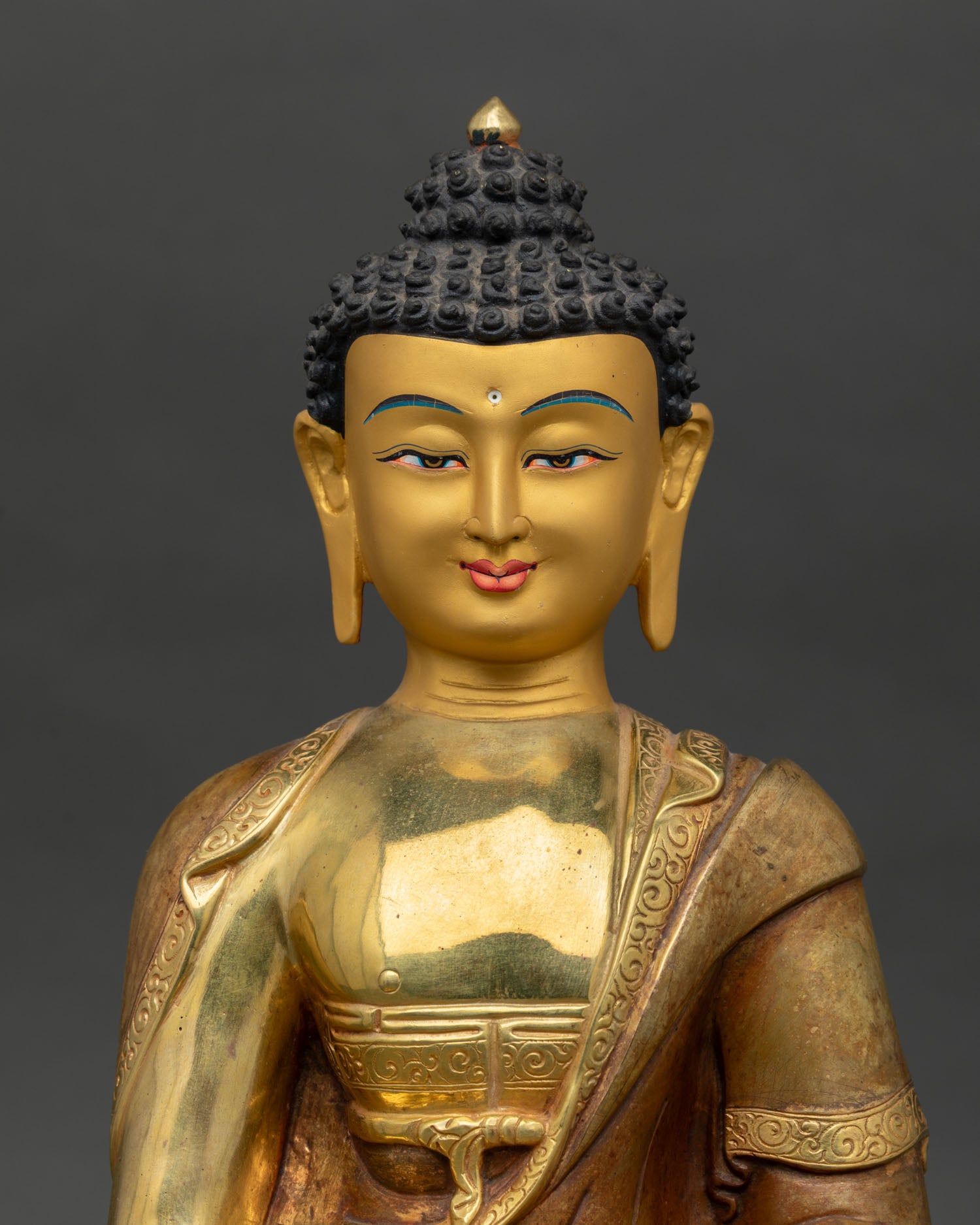 Close up of Amitabha Buddha Statue showing serene face and intricate details