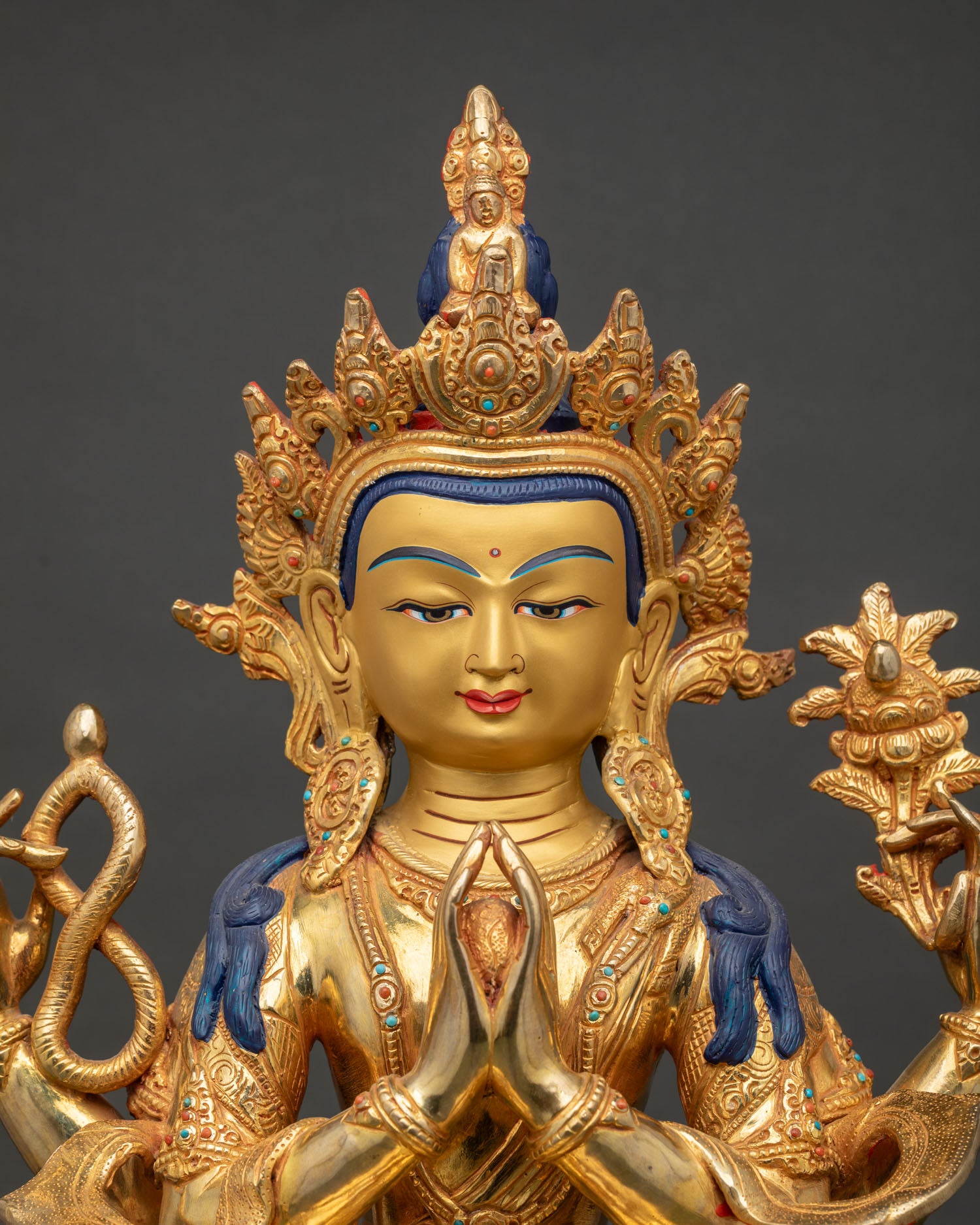 Close up of Avalokiteshvara Chenrezig face with semi precious stones and intricate Newari craftsmanship