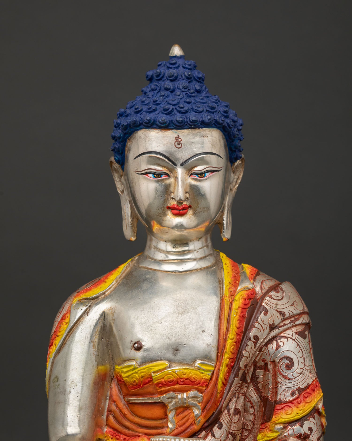 Close up of Buddha Shakyamuni statue, showing serene face expression and intricate Nepalese craftsmanship