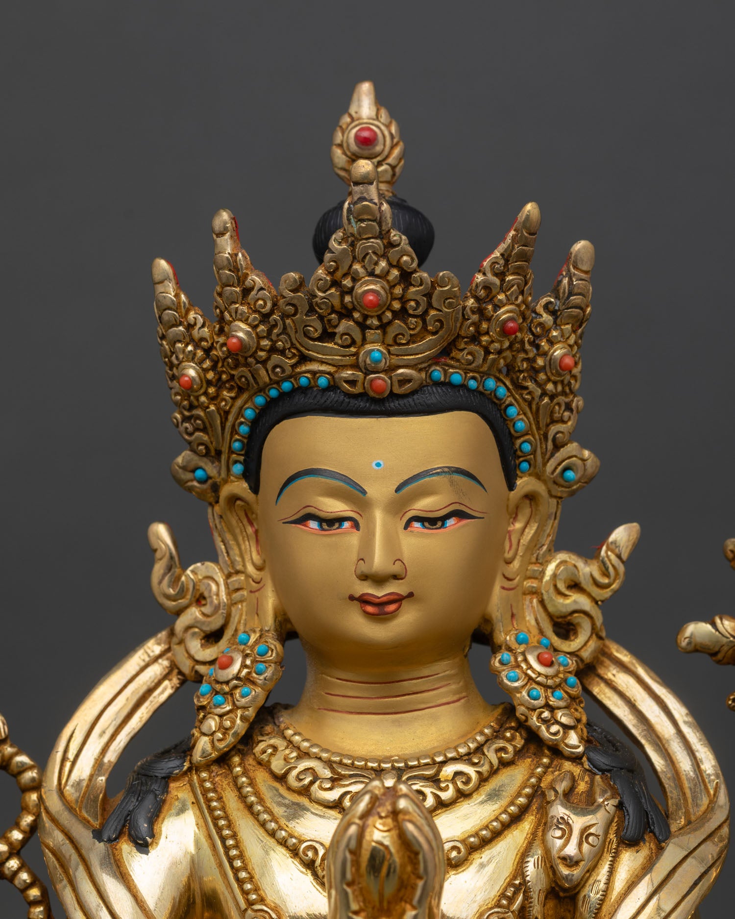 Close up of Chenrezig serene face hand painted expression Bodhisattva compassion