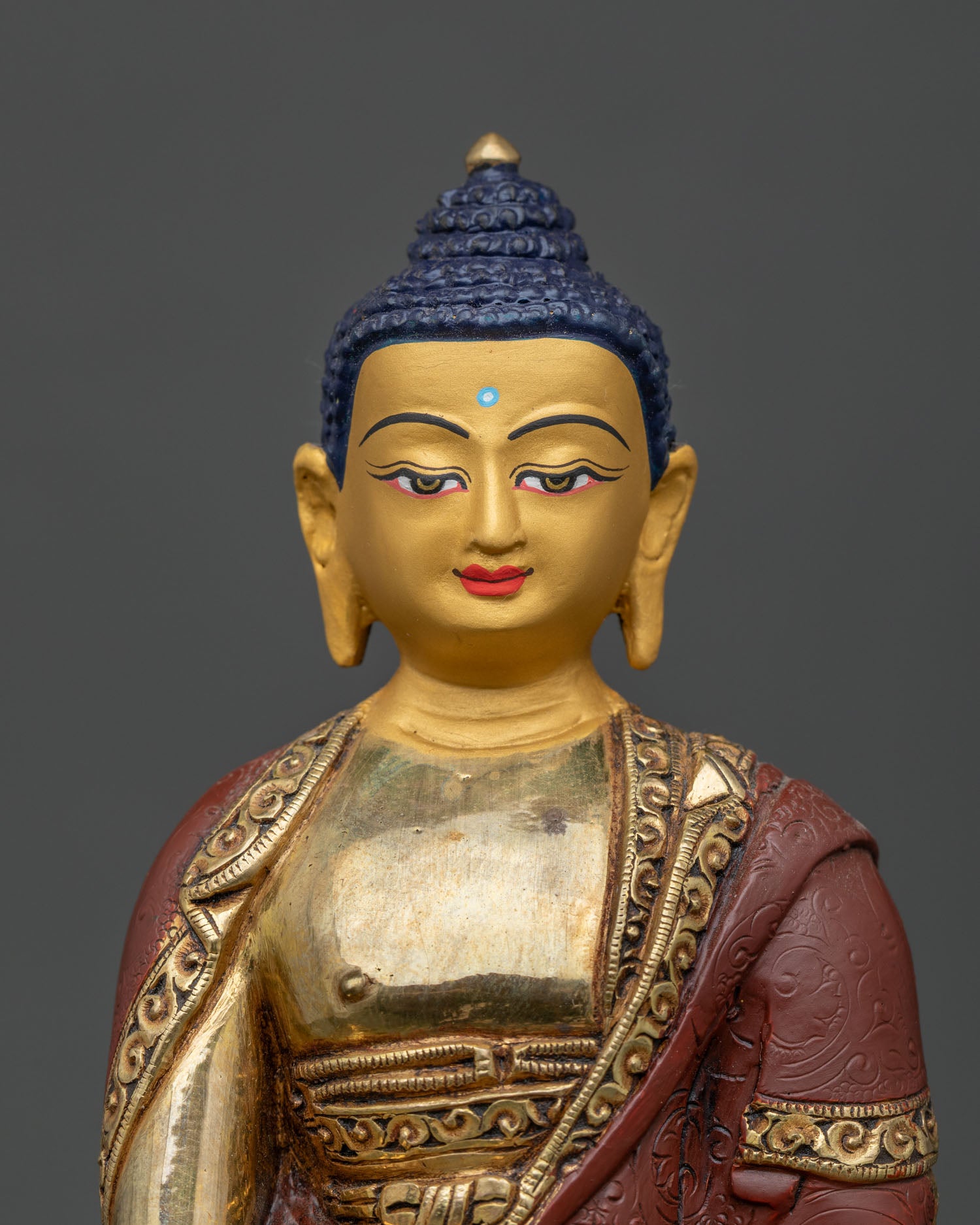Close-up of copper Medicine Buddha statue with gold fire-gilding, Nepal handicraft