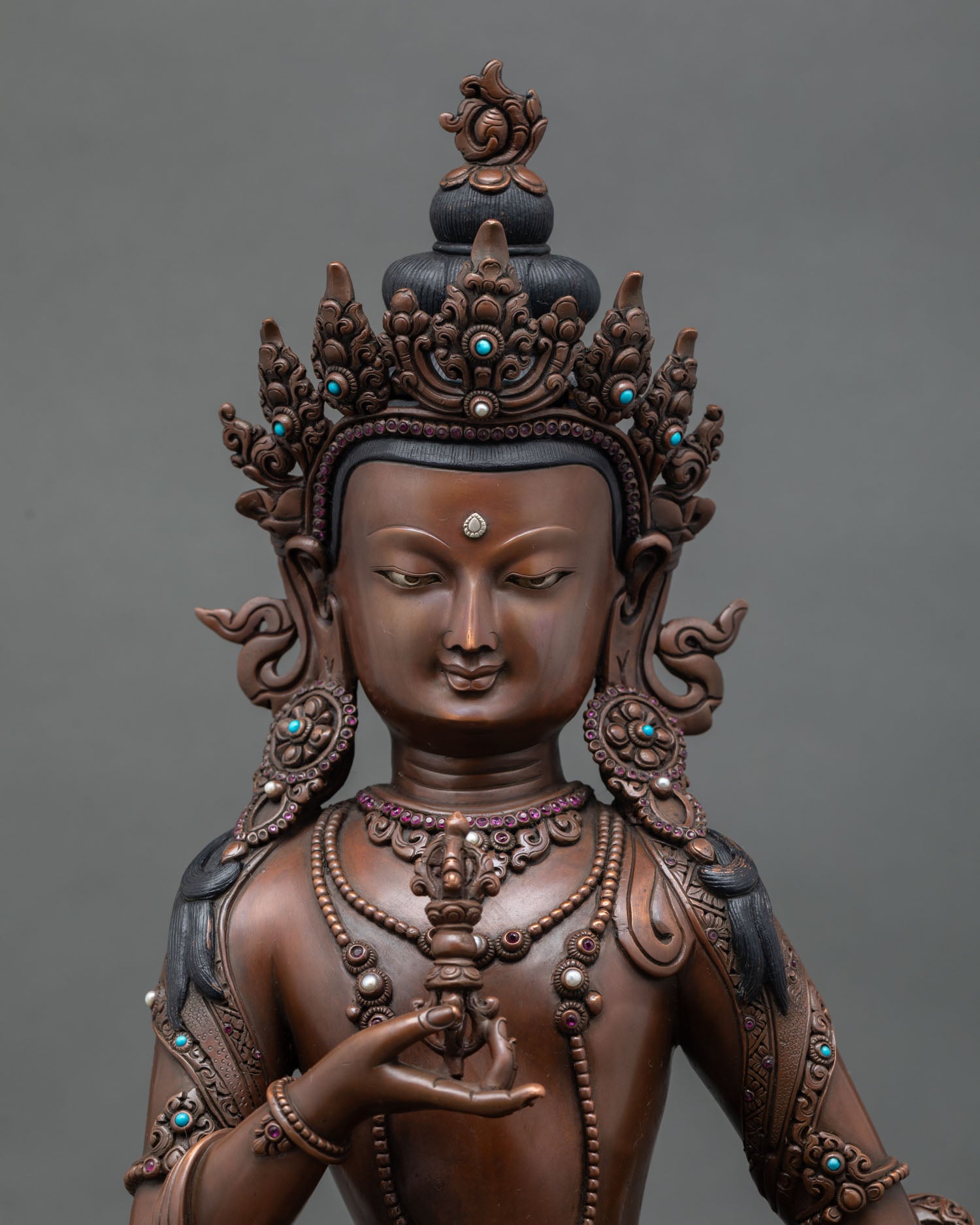 Close-up of Dorje Sempa sculpture with acrylic details and sacred ornaments
