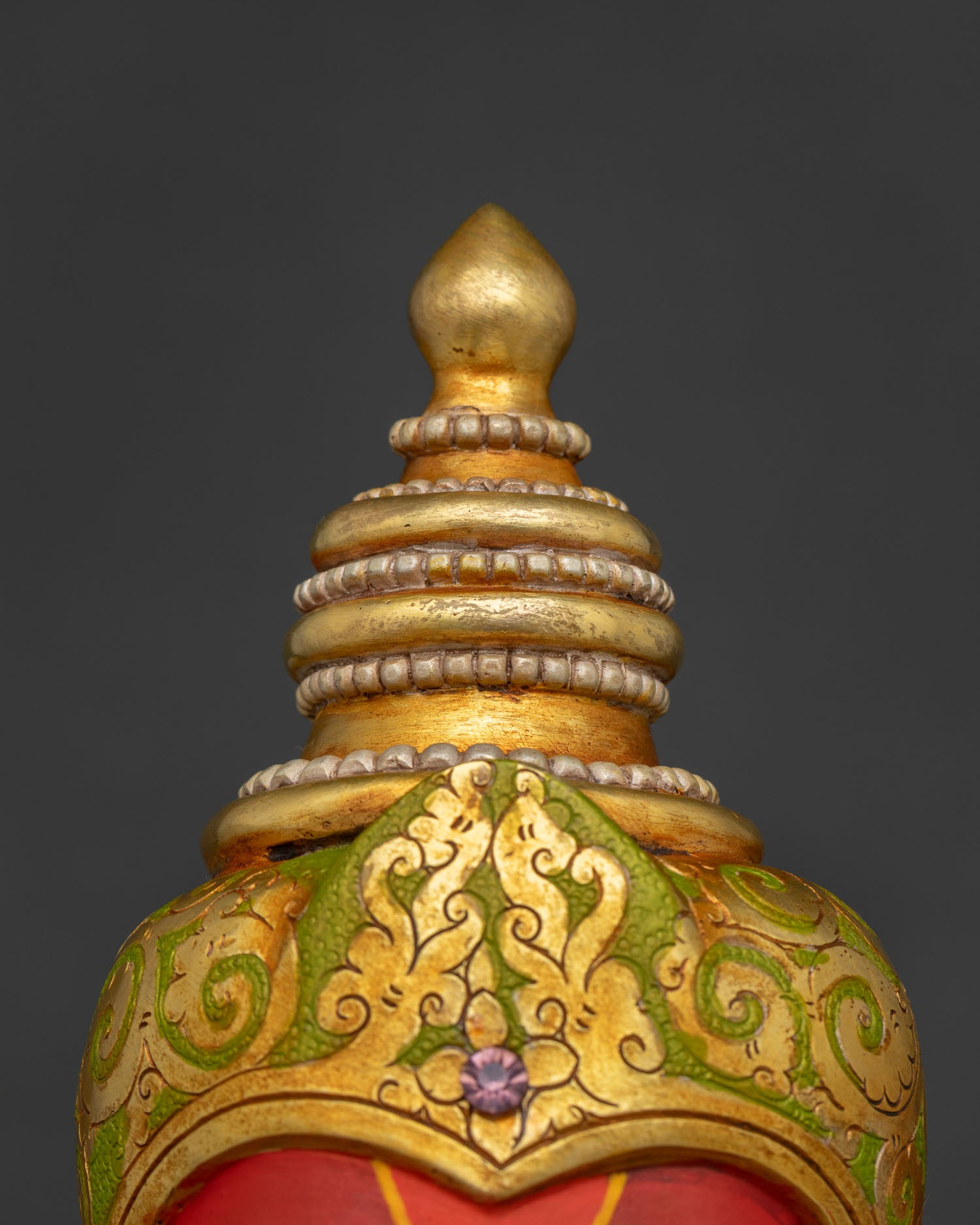 Close-up of Ganesha statue tiered gold Mukut crown, Nepal Newari craftsmanship