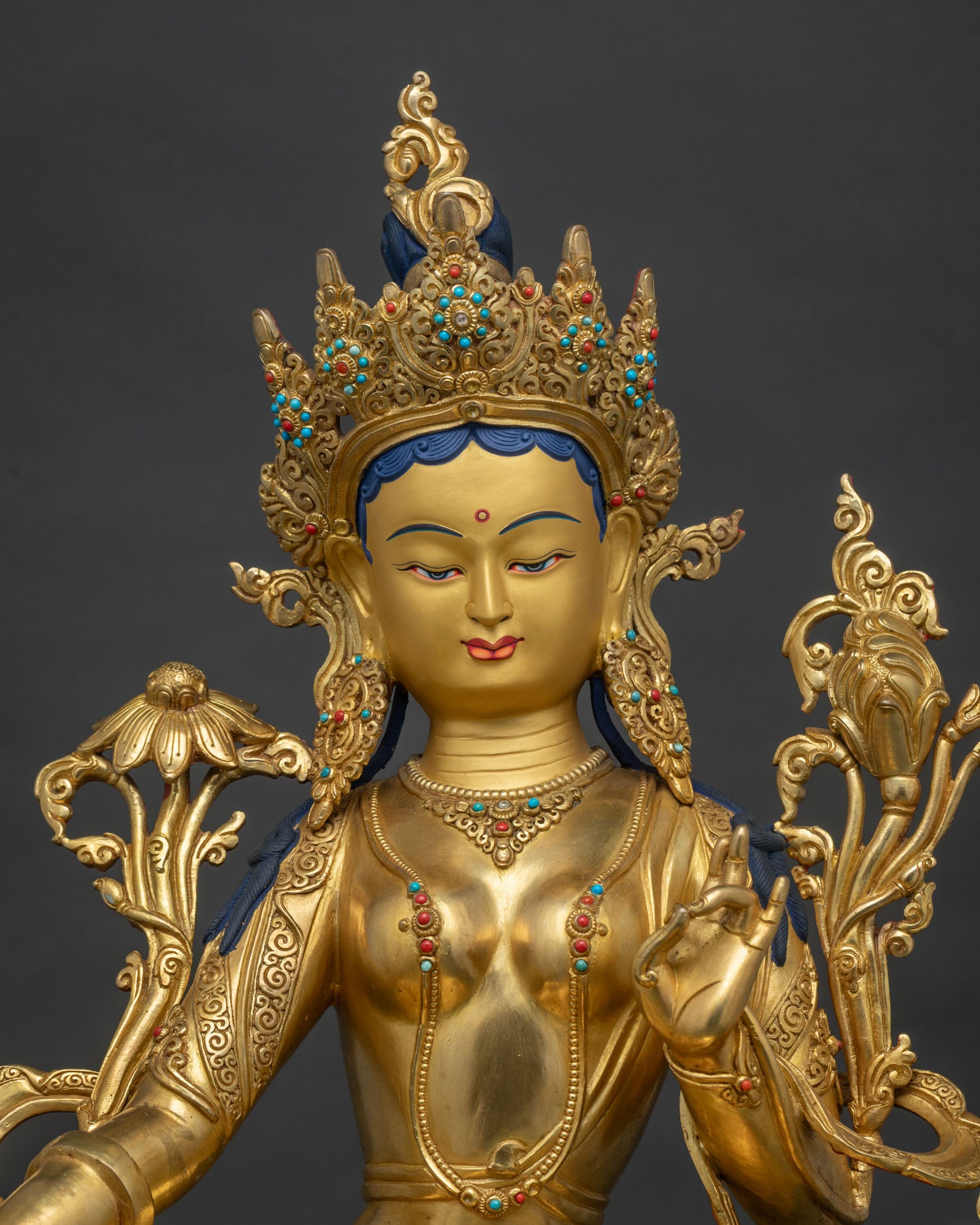 Close up of Green Tara Statue showing gold fire gilding and lotus pedestal detail