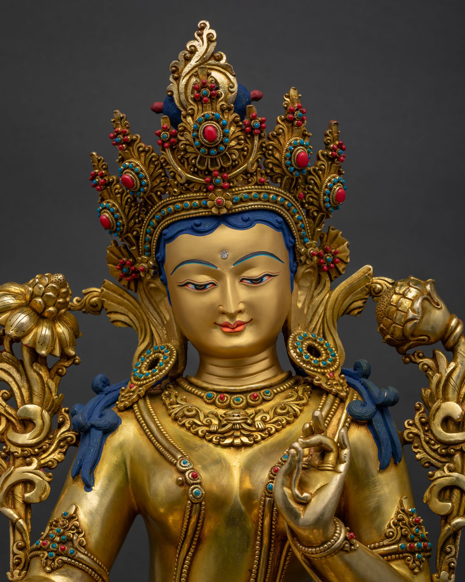 Close Up of Green Tara Statue with Gold Painted Face and Jeweled Crown Handcrafted in Nepal