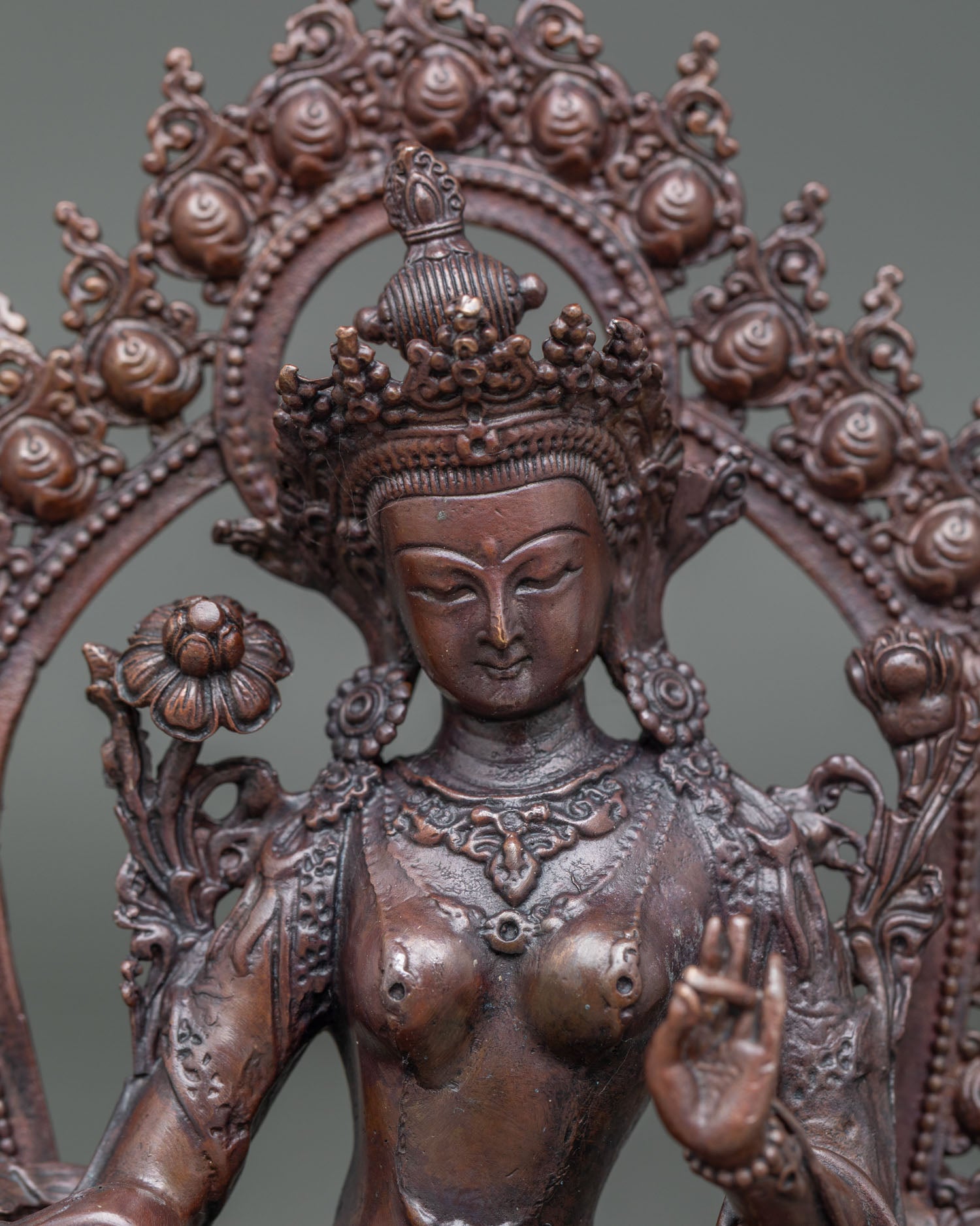 Close-up of Green Tara Statue with Varada Mudra, Utpala Lotus and oxidized finish