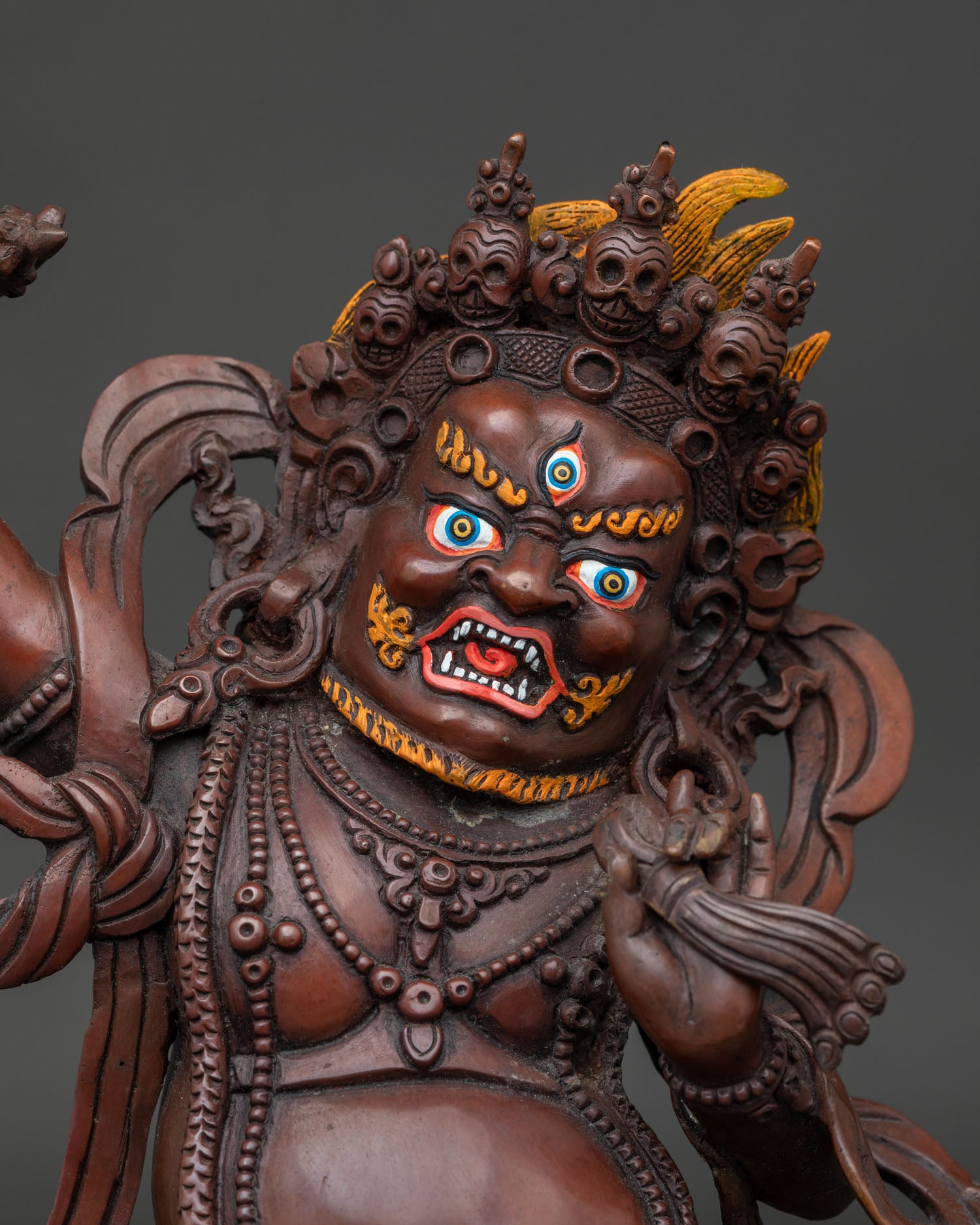 Close Up of Handmade Vajrapani Statue with Oxidized Copper Finish and Sacred Ornaments