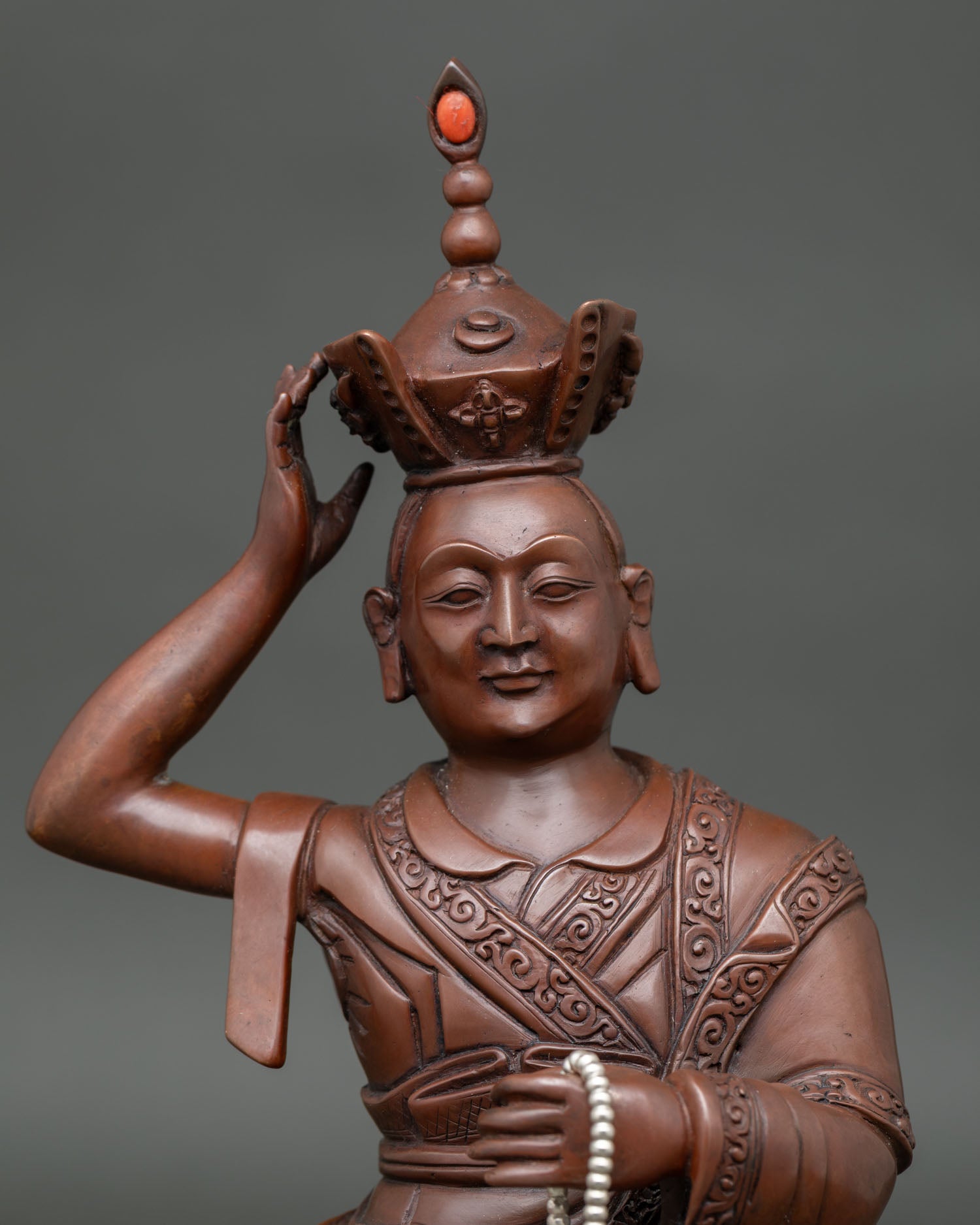 Close Up of Karmapa Oxidized Copper Statue with Hand Carved Royal Garments.