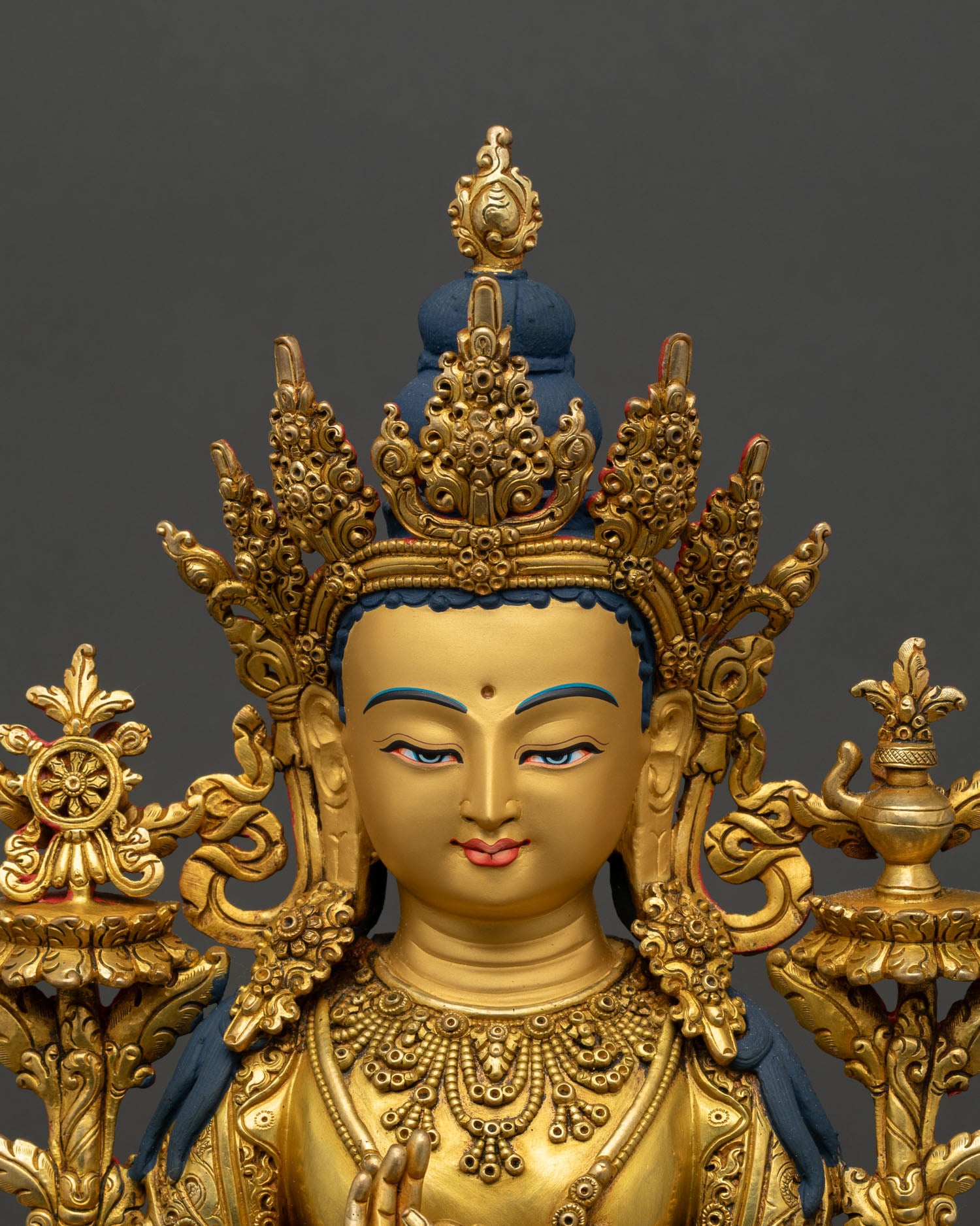 close up of maitreya buddha statue, gold gilded copper with intricate throne details