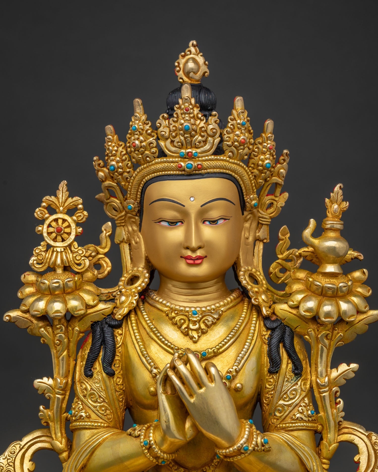 Close up of Maitreya Future Buddha Statue showing gold gilding and lotus pedestal detail