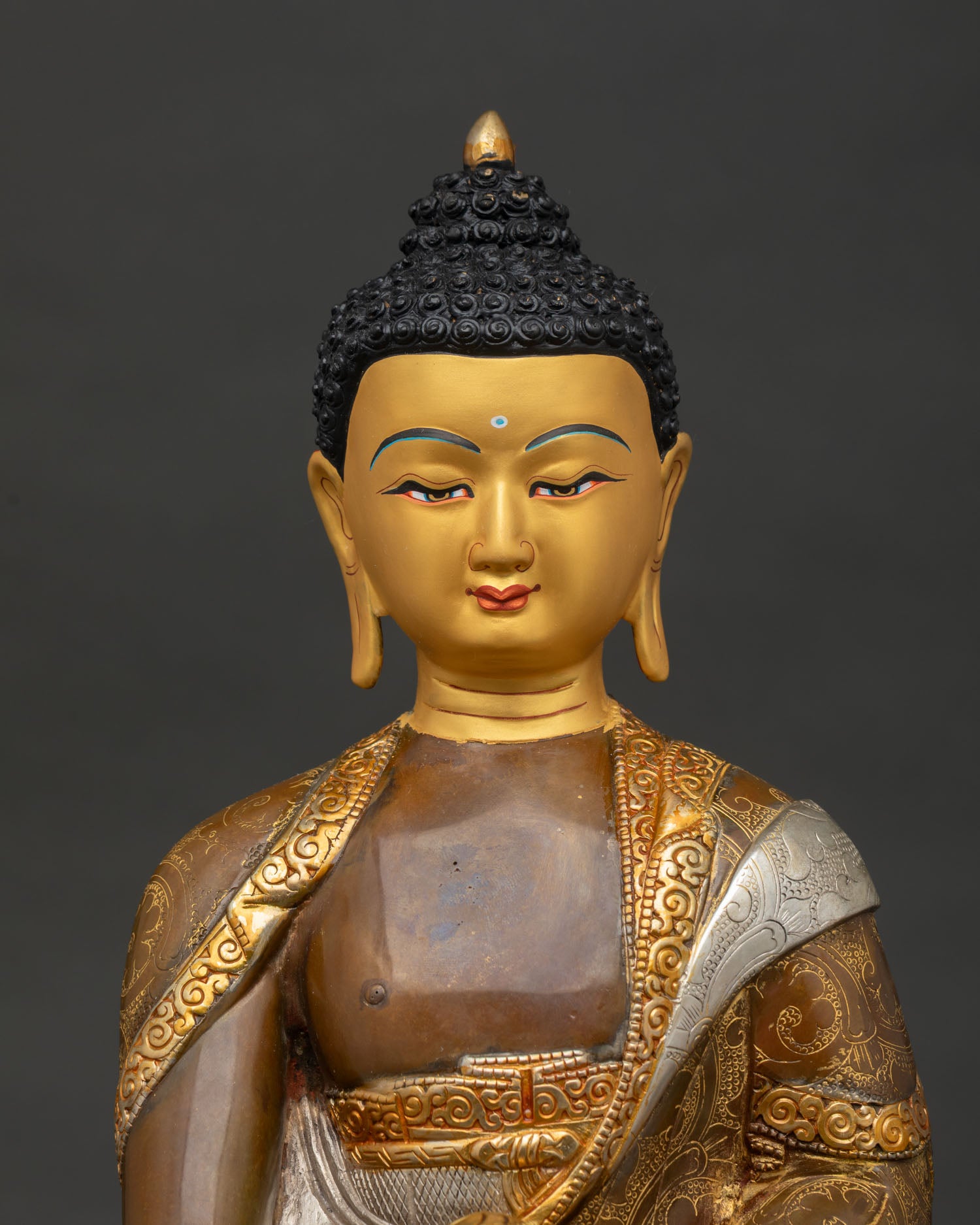 Close Up of Oxidized Shakyamuni Buddha Statue with Gold Gilded and Silver Plated Details
