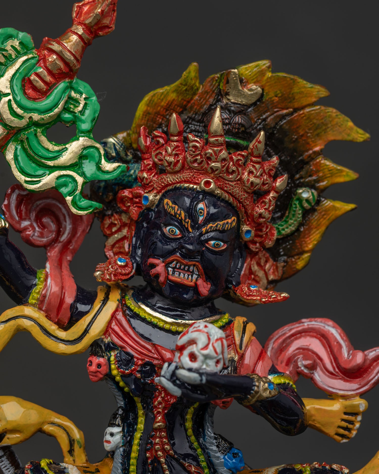 Close Up of Palden Lhamo Three Eyed Face with Hand Carved Halo and Fierce Expression.