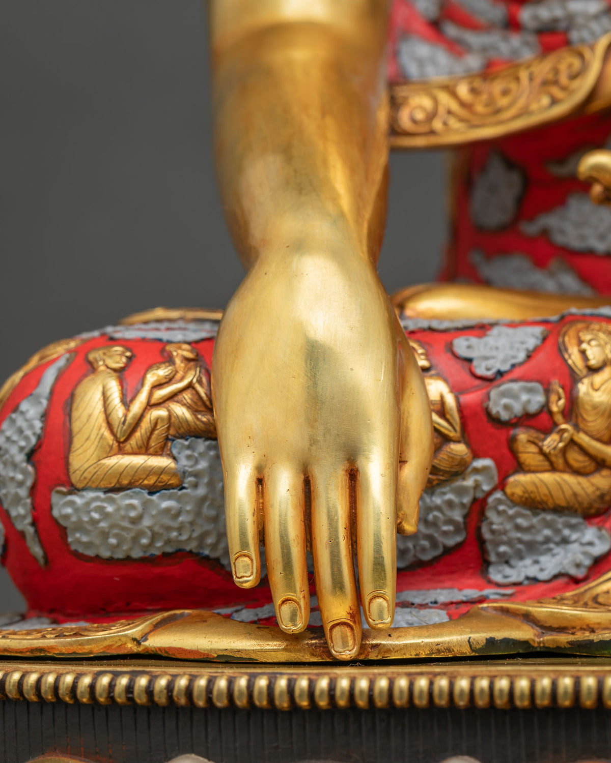 Close-up of Shakyamuni Buddha statue hand in Bhumisparsha Mudra, gold fire-gilded copper, Nepal