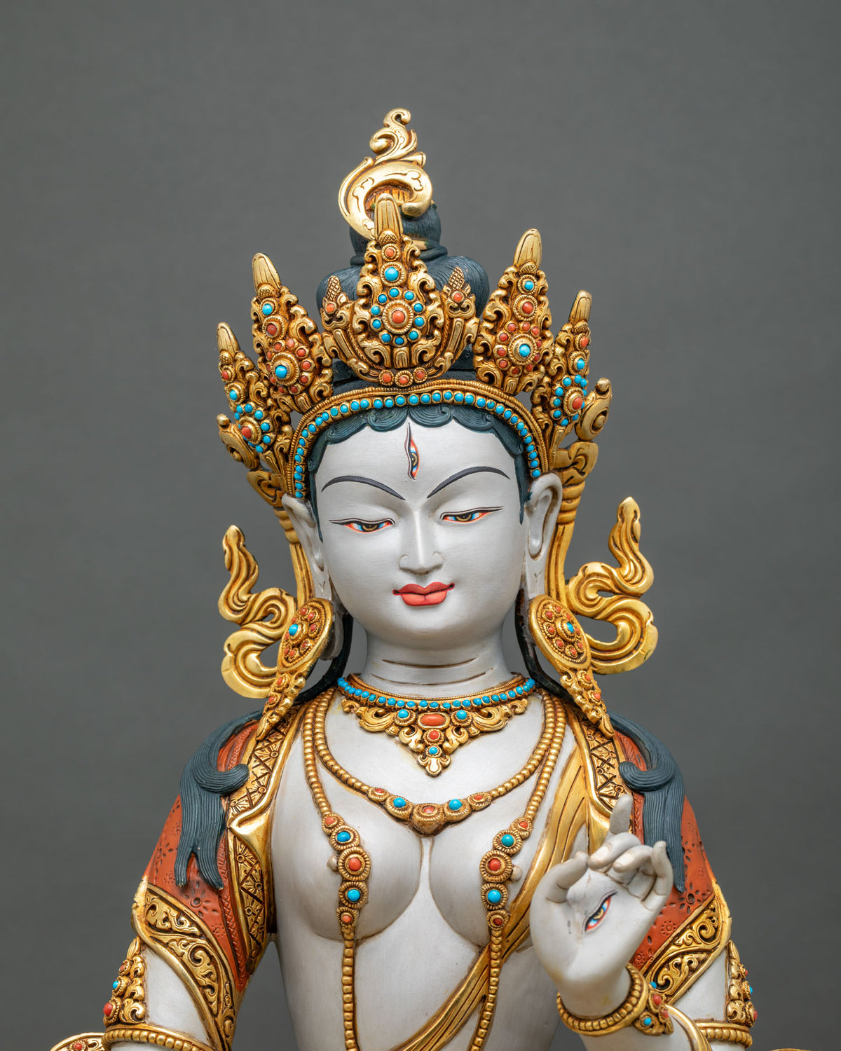 Close-up of Sitatapatra Dukkar statue with 24K gold gilding and semi-precious stones, handmade in Nepal