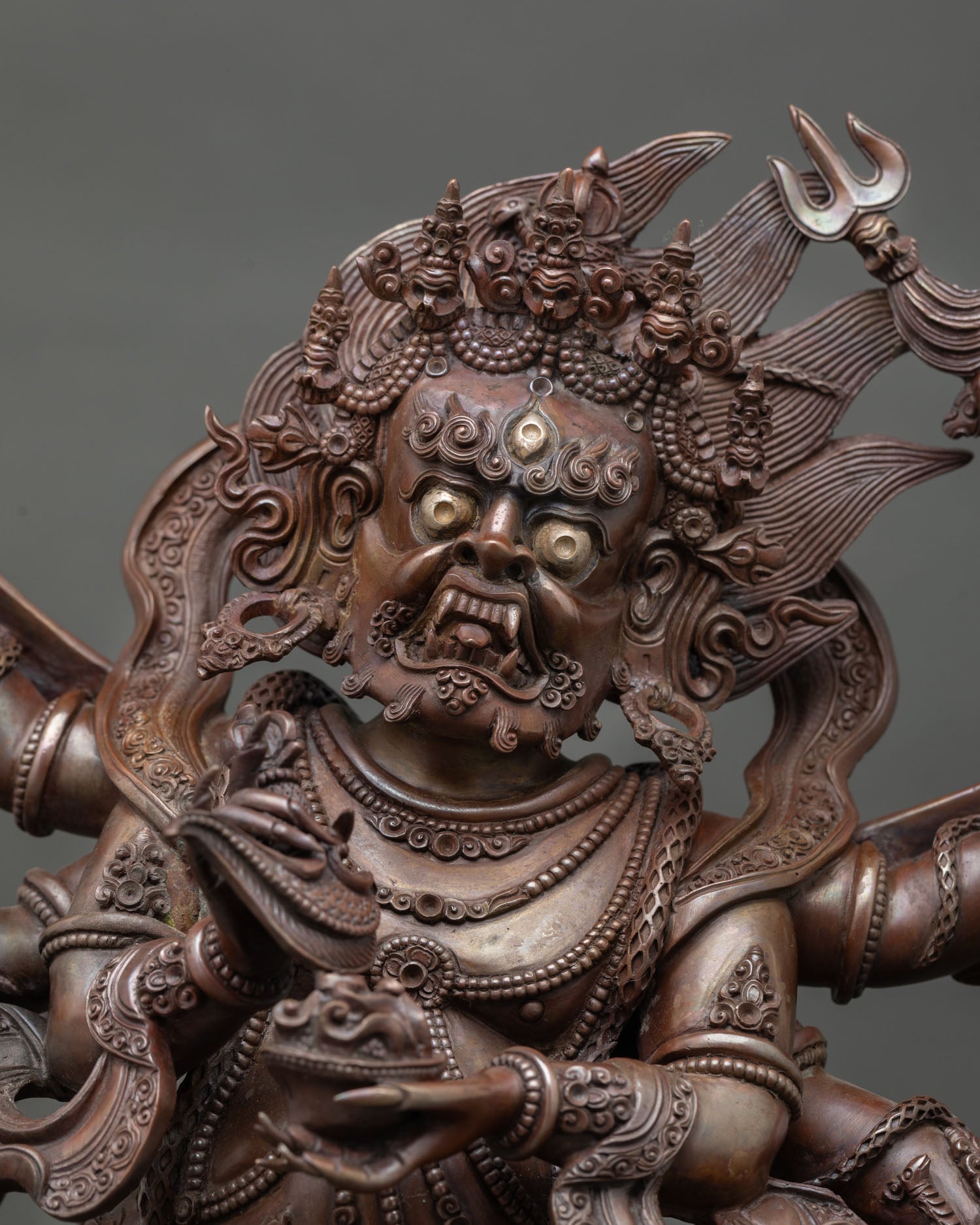 Close up of Six Armed Mahakala face with fierce expression, Newari artisan Himalayan Buddhist wrathful deity statue for meditation space