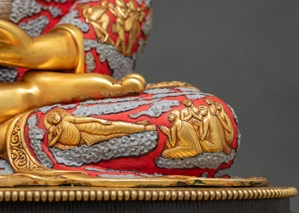 Close-up of the Nirvana Buddha and disciples relief on the lap of the Shakyamuni Buddha statue