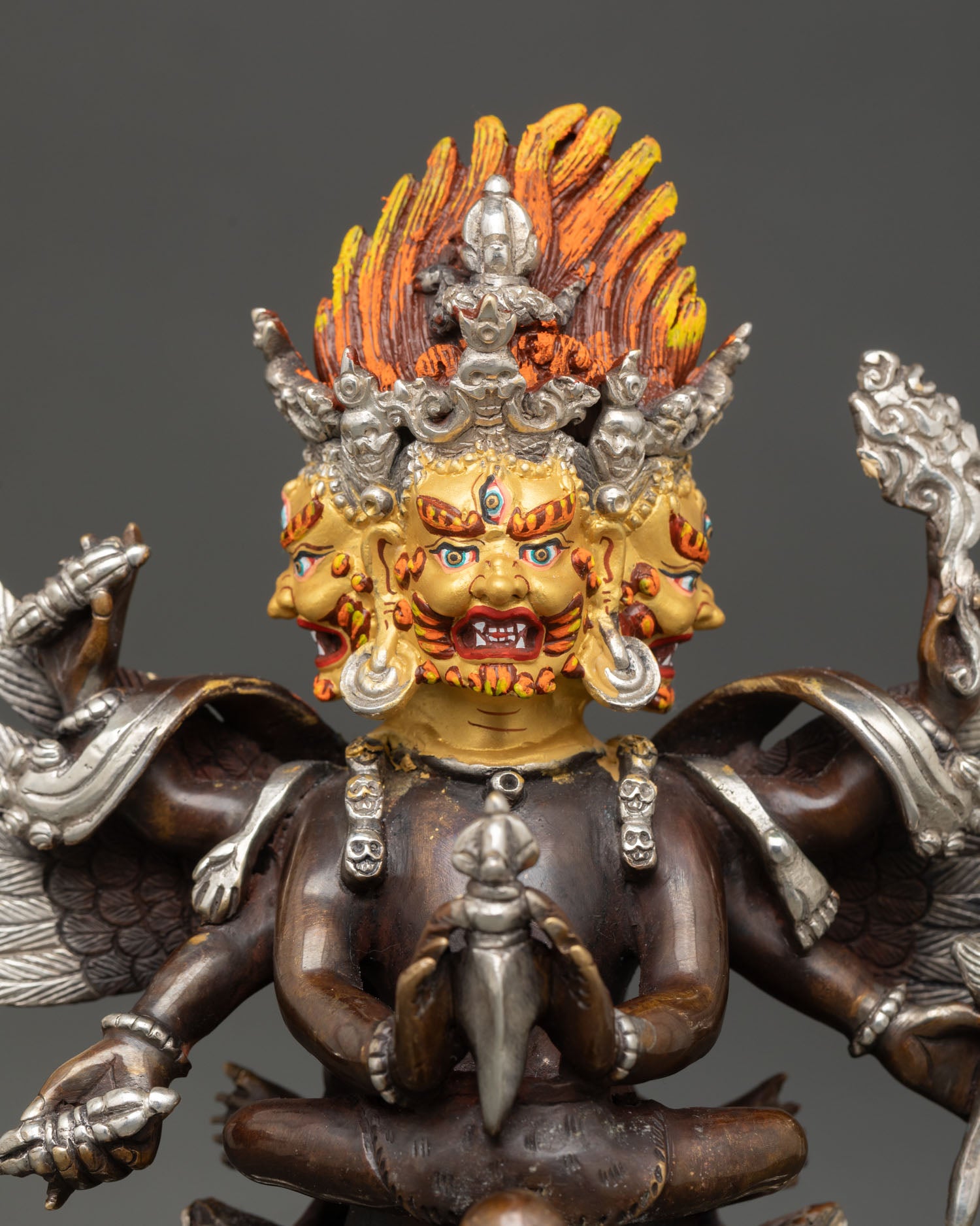 Close up of Vajrakilaya with gold-painted face showcasing intricate Newari art.