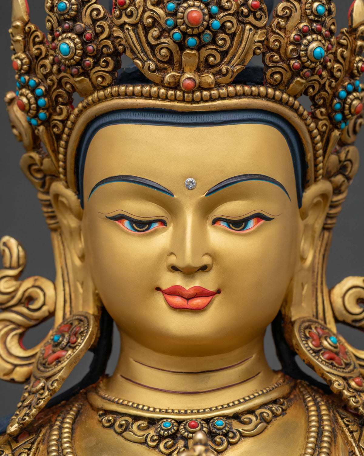 Close-up of Vajrasattva face, gold-gilded features with Five-Jeweled Crown