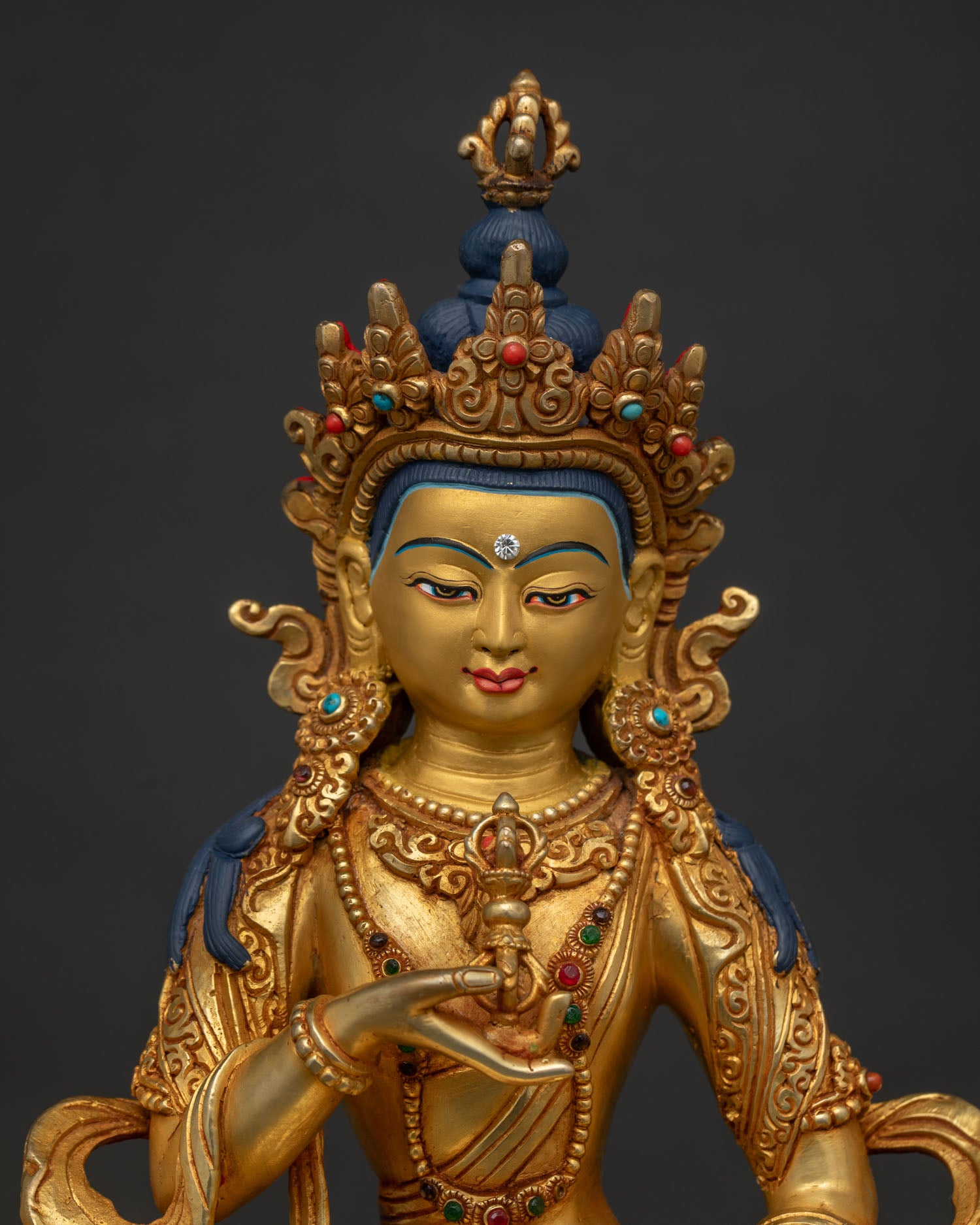 Close Up of Vajrasattva Gold Painted Face and Five Jewel Crown.