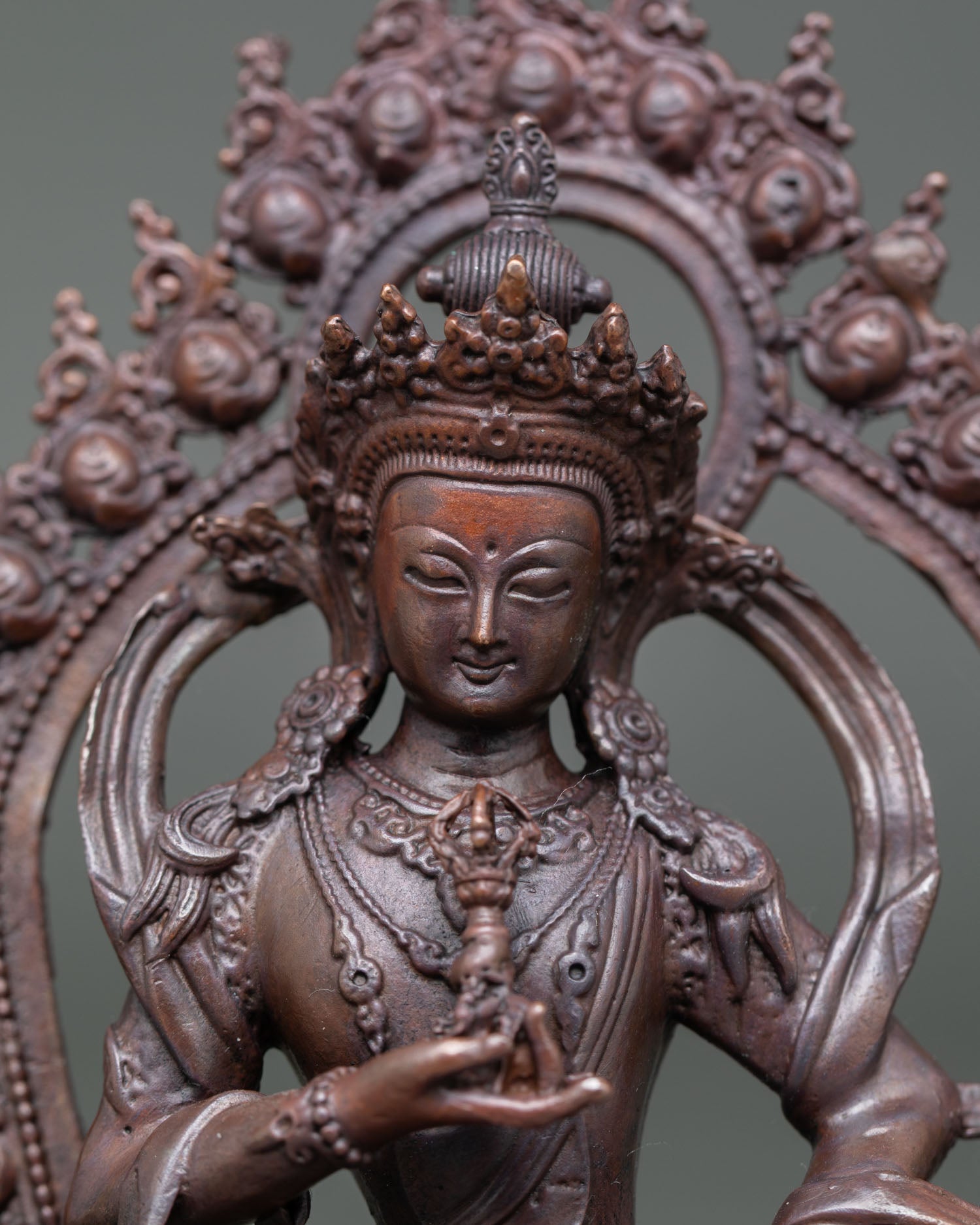 Close-up of Vajrasattva Statue, showing oxidized finish and intricate Himalayan craftsmanship
