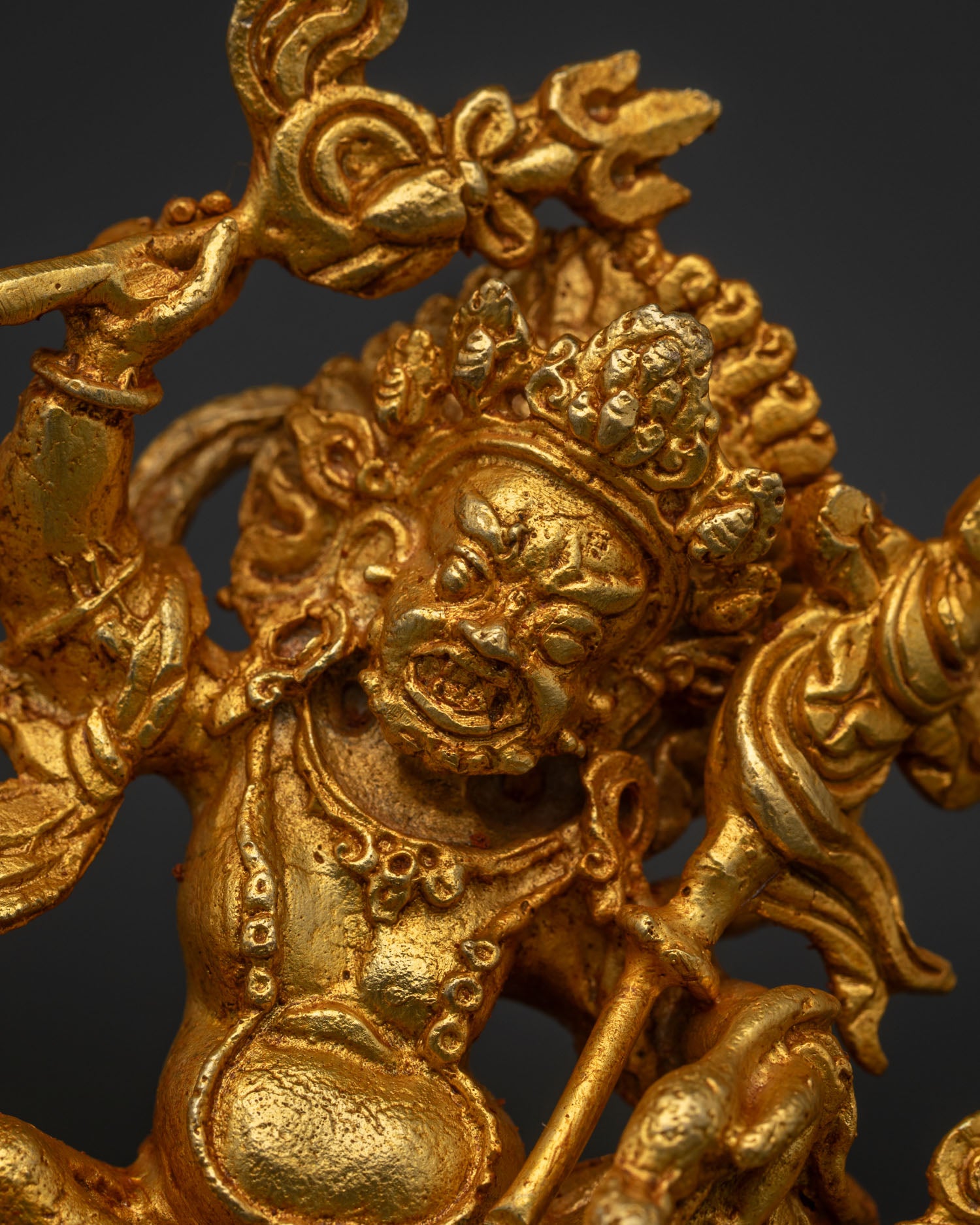 Close Up of White Dzambhala Holding Staff Ritual Scepter and Mongoose.