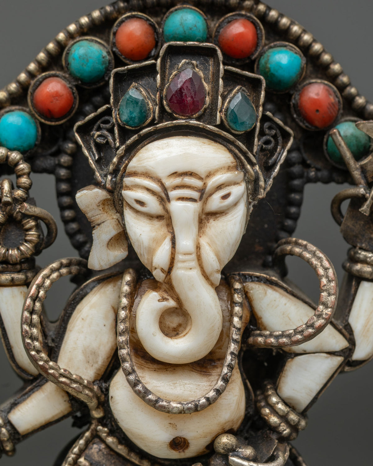 close up of white stone ganesh face and gemstone crown handcrafted in nepal