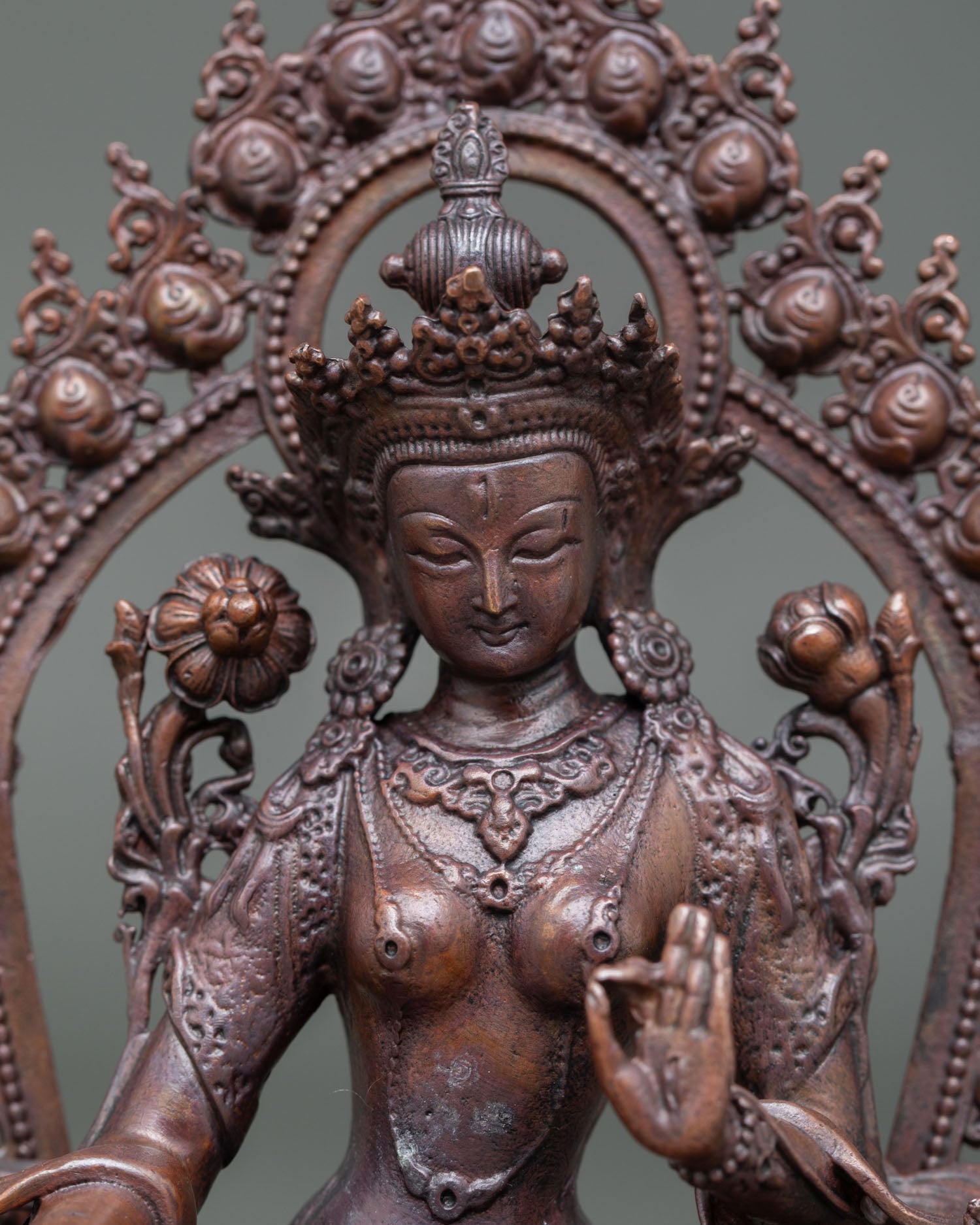Close-up of White Tara Statue, showing seven eyes, radiant halo and detailed craftsmanship