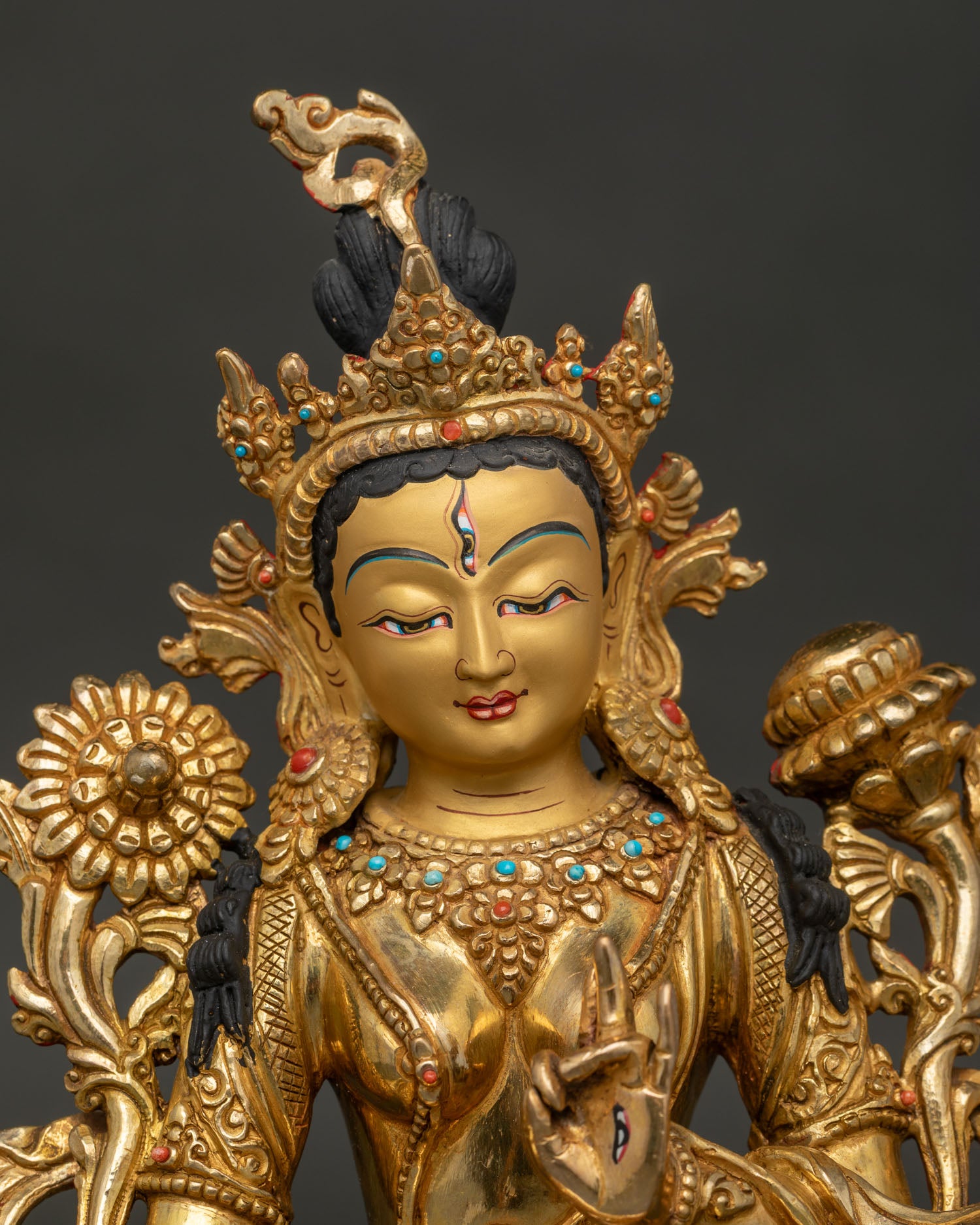 Close-Up of White Tara Statue with Gold-Painted Face and Seven Eyes