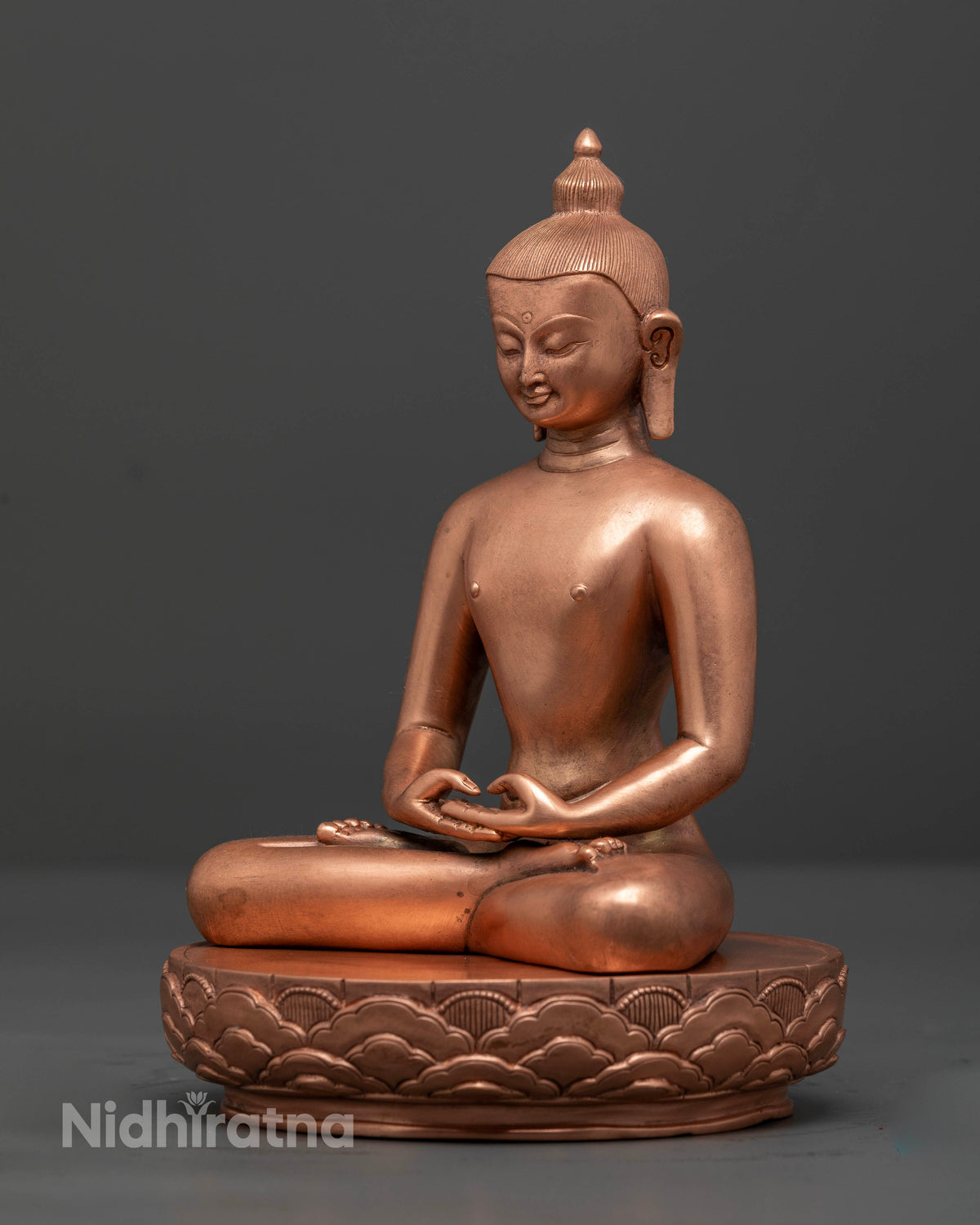 Close up of Samantabhadra Buddhist statue seated on a blooming lotus pedestal