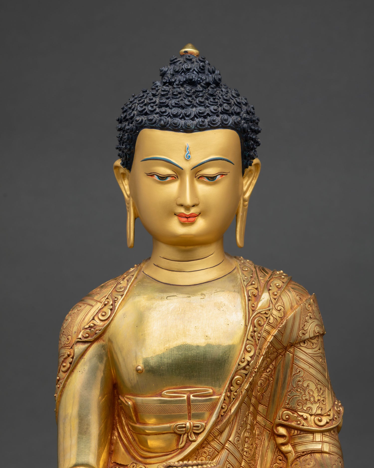 Close up Shakyamuni Buddha face with Earth Touching Mudra and begging bowl