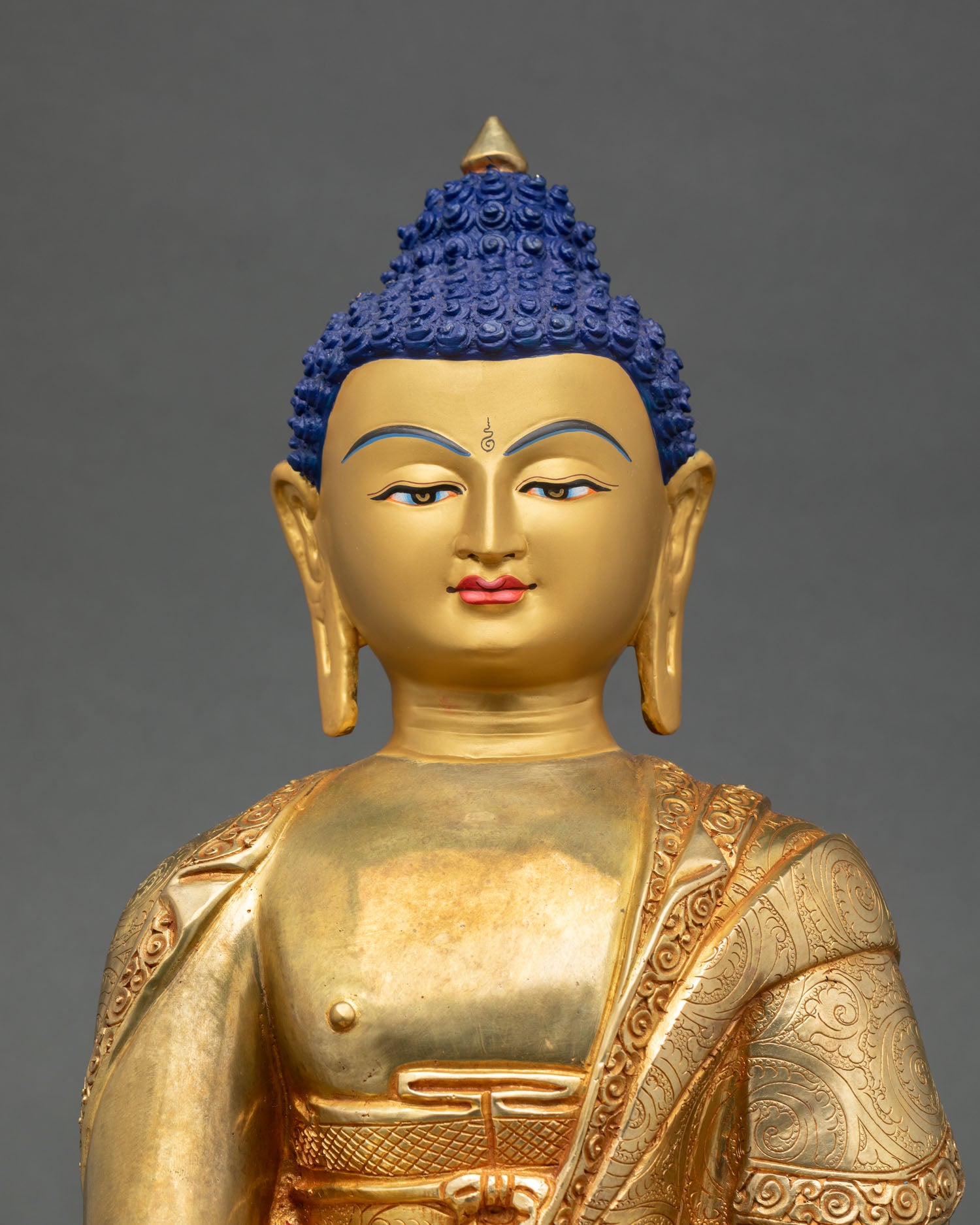 Close up Shakyamuni Buddha face with serene expression Newari artisan Himalayan Buddha sculpture