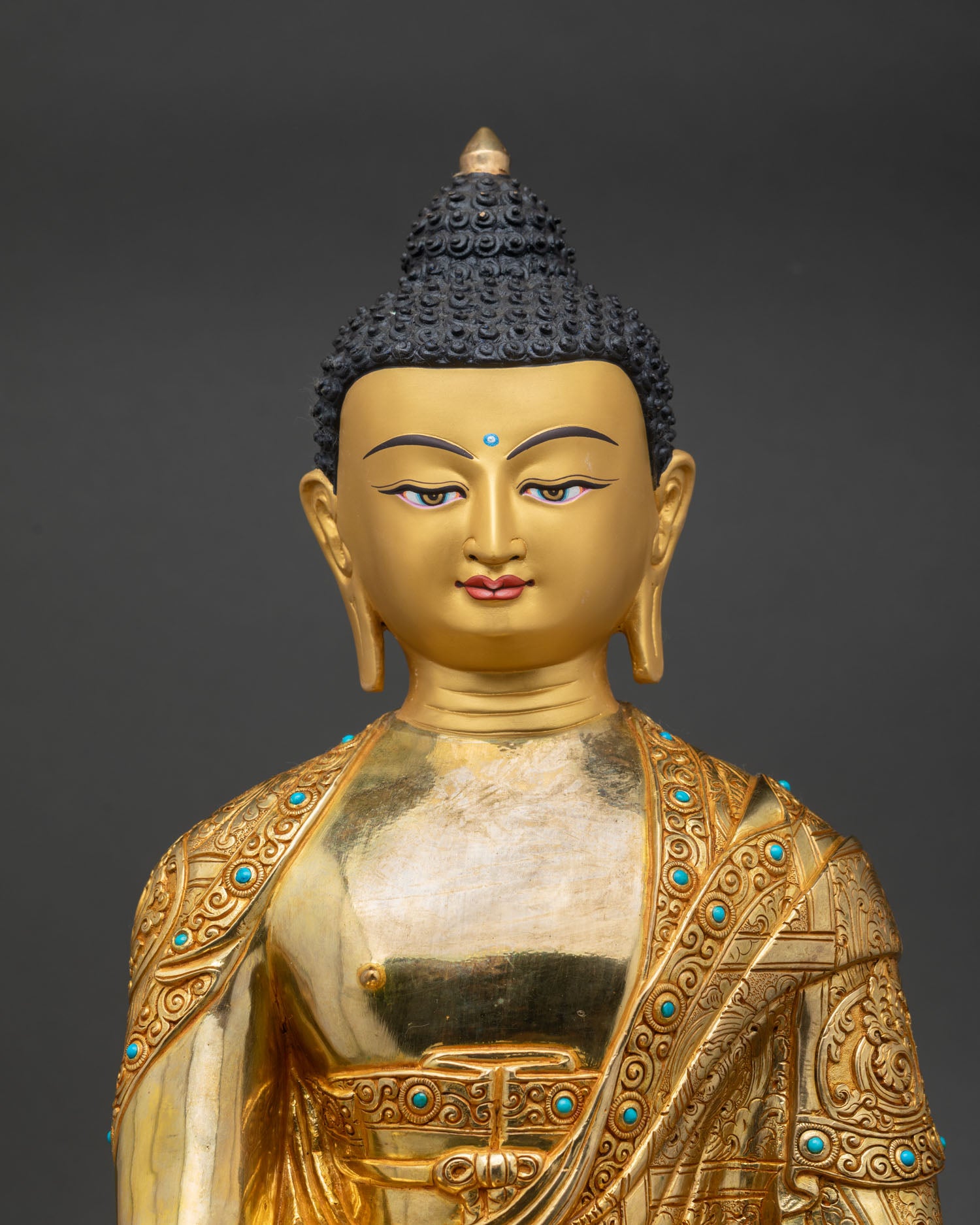 close up shakyamuni buddha statue, gold gilded copper buddhist altar sculpture detail