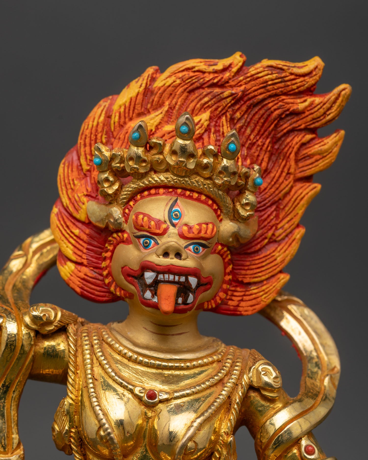 Close up Simha Mukha face turquoise coral stones kartika skull cup detail