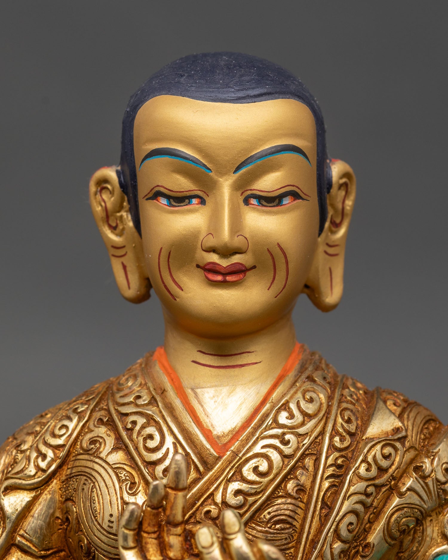 Close up Tsongkhapa face serene expression jeweled crown meditation altar decor