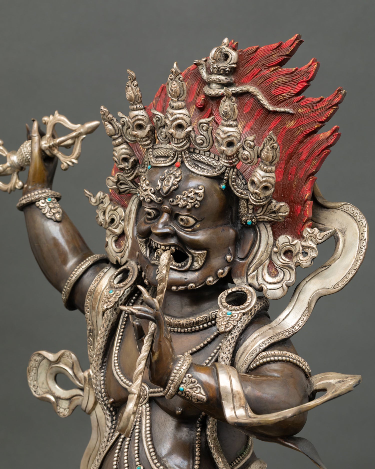 Vajrapani statue side detail highlighting ornaments tiger skin robe and intricate carving work