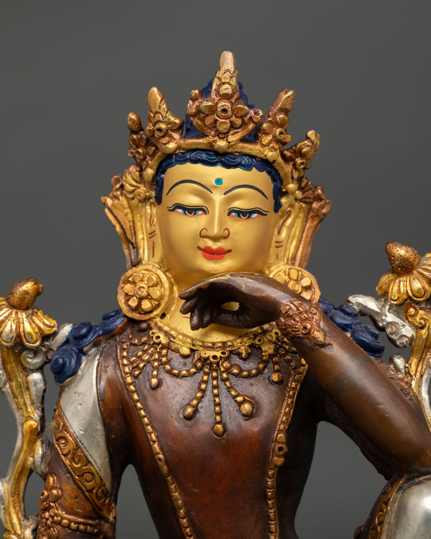 Close up view Lokeshvara bodhisattva statue showing detailed copper craftsmanship and ornament work