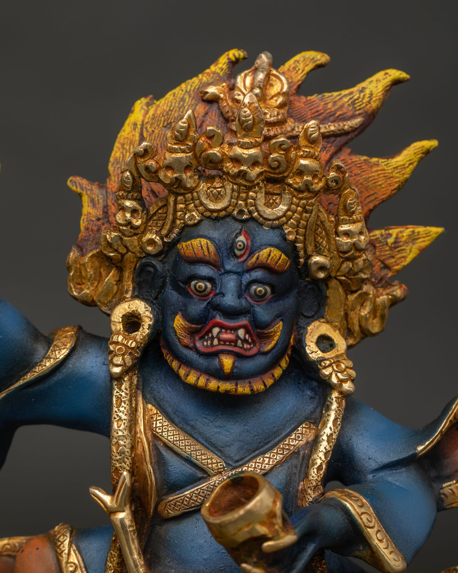 Close Up View of Mahakala Bernagchen Statue Wearing Five Skull Crown and Acrylic Colors